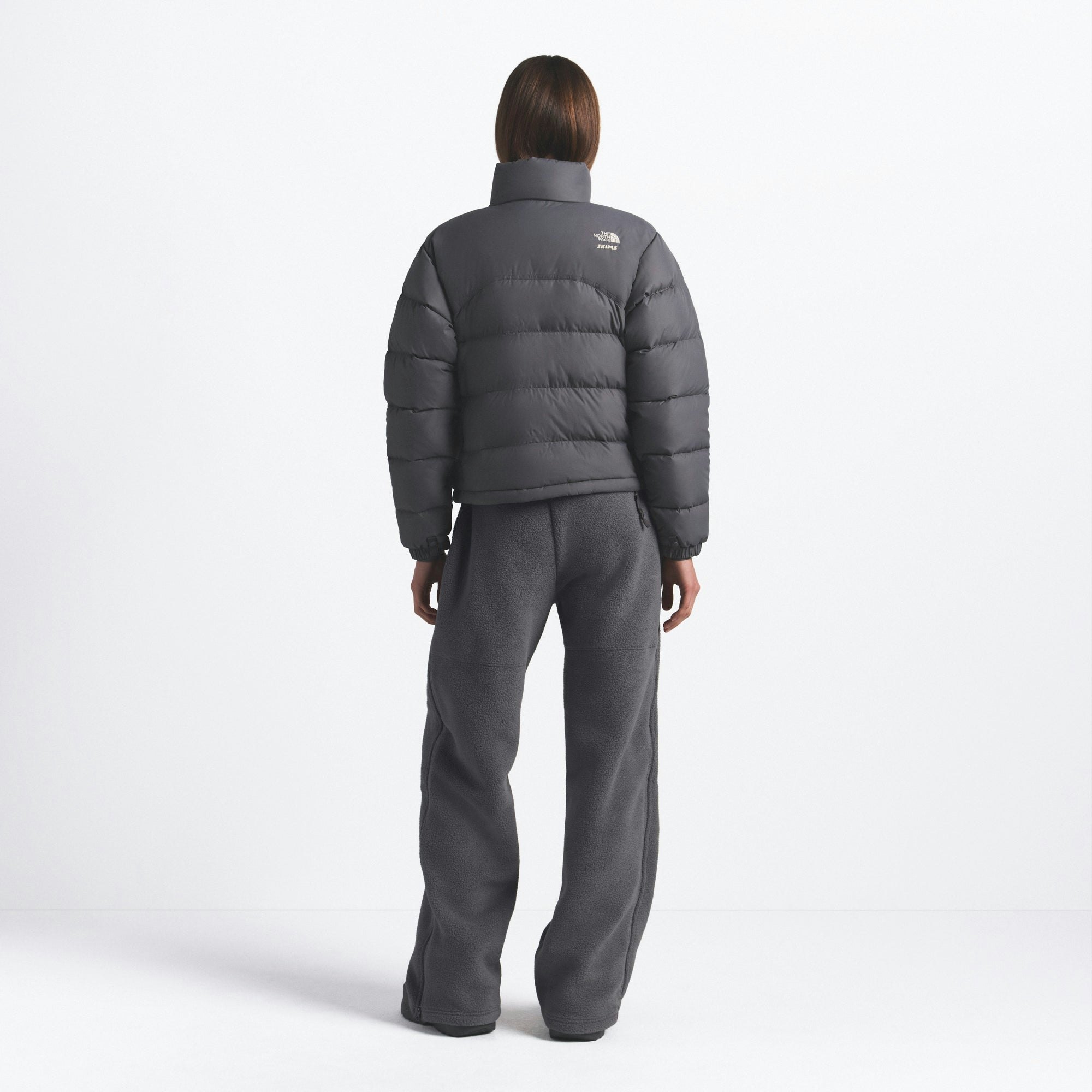 THE NORTH FACE X SKIMS 2000 RETRO NUPTSE JACKET | GUNMETAL ON A MODEL FRONT VIEW @ | FOCUS: 0.0, 1.0, 0.9