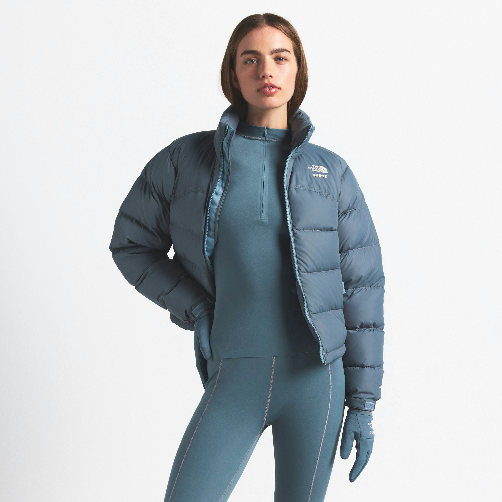 THE NORTH FACE X SKIMS 2000 RETRO NUPTSE JACKET | KYANITE ON A MODEL FRONT VIEW @ | FOCUS: 0.0, 1.0, 0.9