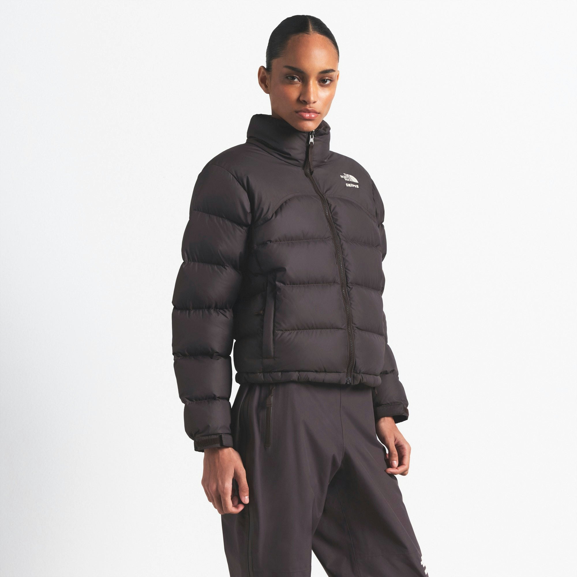 THE NORTH FACE X SKIMS 2000 RETRO NUPTSE JACKET | PHOENIX ON A MODEL FRONT VIEW @ | FOCUS: 0.0, 1.0, 0.9