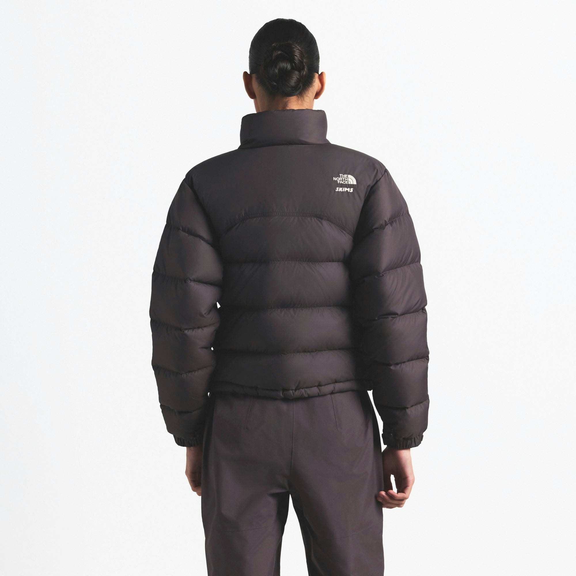 THE NORTH FACE X SKIMS 2000 RETRO NUPTSE JACKET | PHOENIX ON A MODEL FRONT VIEW @ | FOCUS: 0.0, 1.0, 0.9
