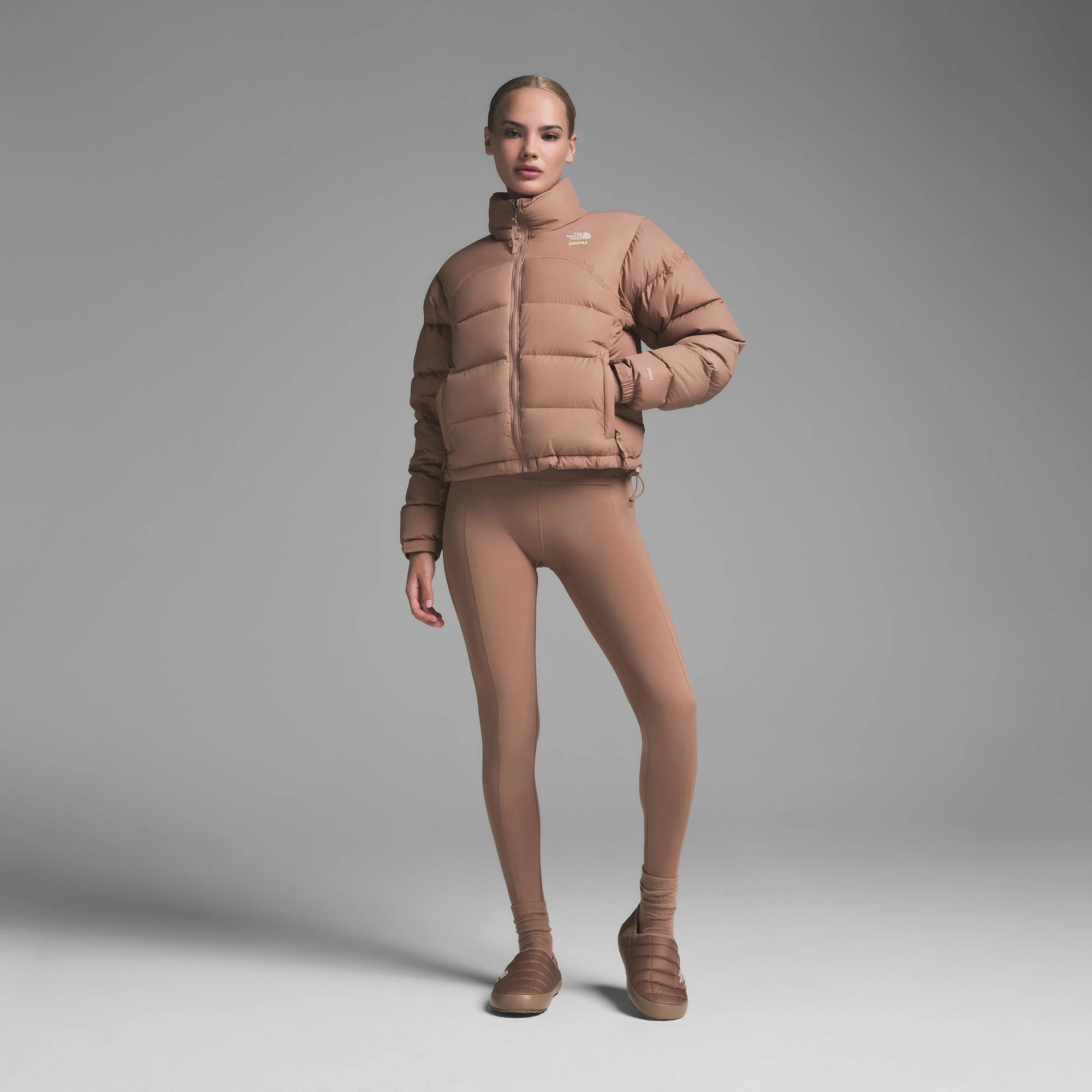 THE NORTH FACE X SKIMS ON A MODEL FRONT VIEW | FOCUS: 0.0, 1.0, 0.9000 RETRO NUPTSE JACKET | SIENNA ON A MODEL FRONT VIEW | FOCUS: 0.0, 1.0, 0.9