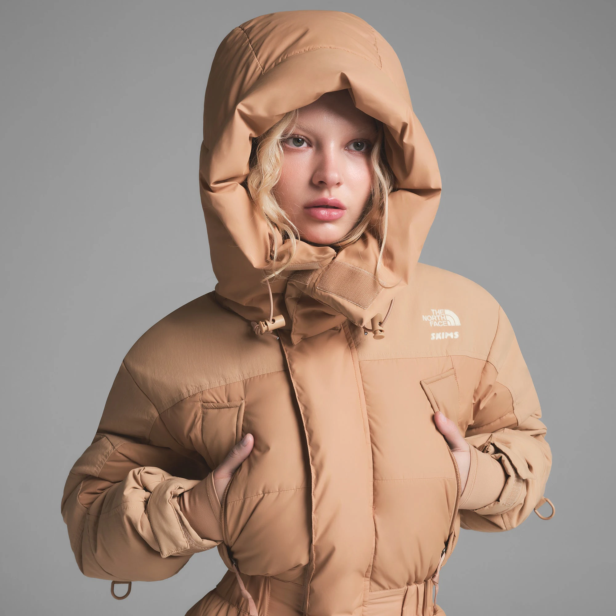 THE NORTH FACE X SKIMS DOWN ONE PIECE | OCHRE ON A MODEL FRONT VIEW