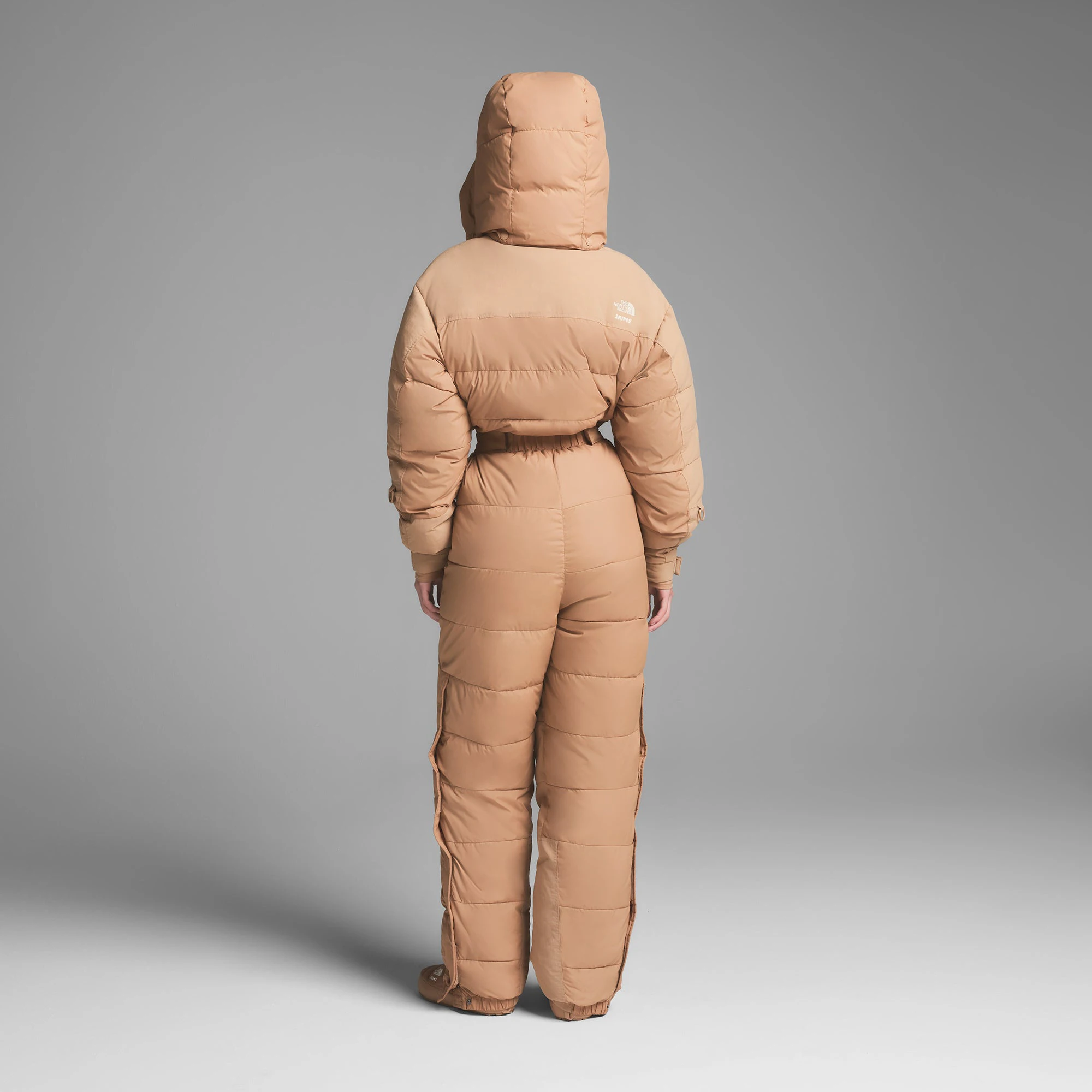 THE NORTH FACE X SKIMS DOWN ONE PIECE | OCHRE ON A MODEL BACK VIEW