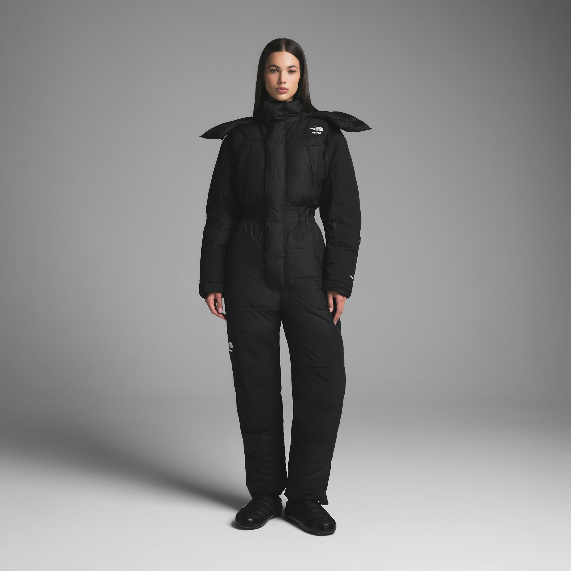 THE NORTH FACE X SKIMS DOWN ONE PIECE | ONYX ON A MODEL FRONT VIEW | FOCUS: 0.0, 1.0, 0.9