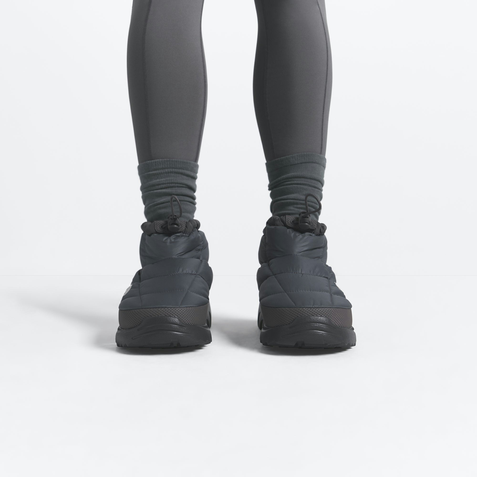 THE NORTH FACE X SKIMS NUPTSE TRACTION CHUKKA | GUNMETAL ON A MODEL FRONT VIEW @ | FOCUS: 0.0, 1.0, 0.9