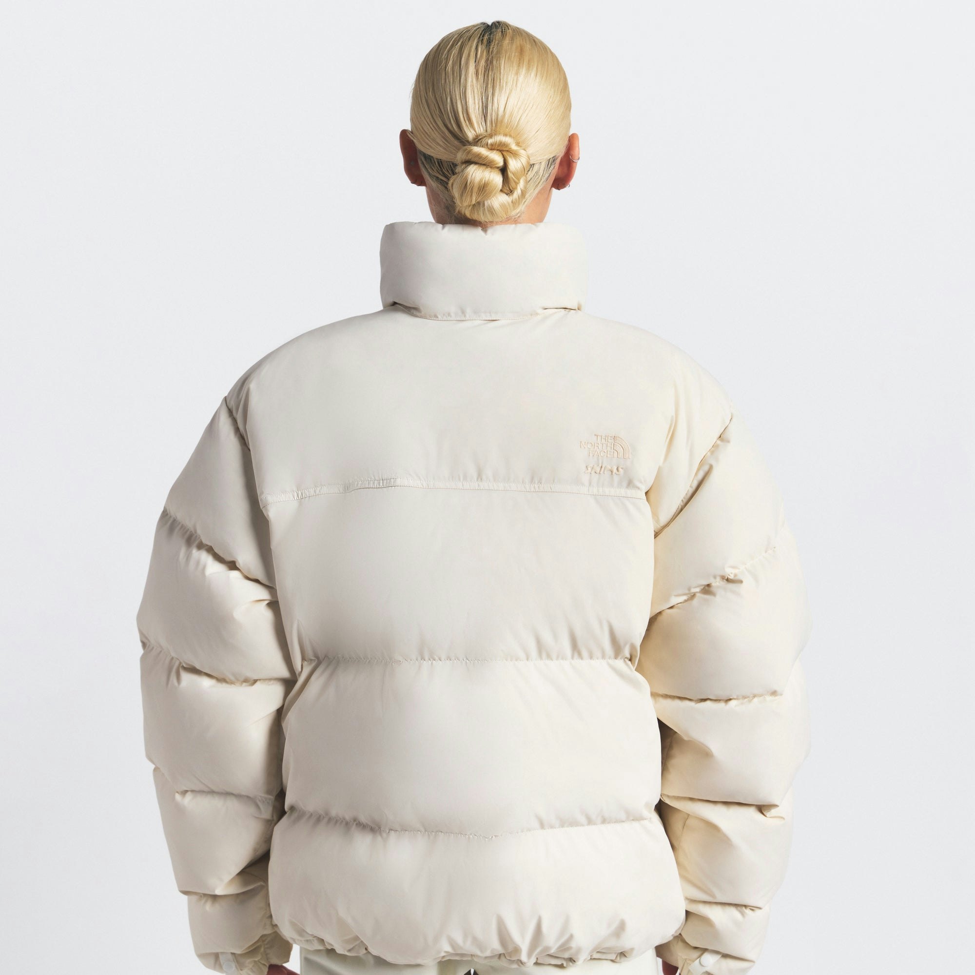 THE NORTH FACE X SKIMS 1996 NUPTSE JACKET | BONE ON A MODEL FRONT VIEW @ | FOCUS: 0.0, 1.0, 0.9