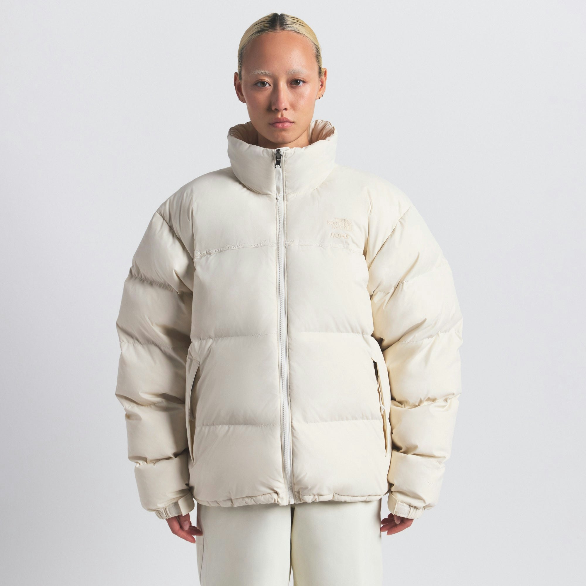 THE NORTH FACE X SKIMS 1996 NUPTSE JACKET | BONE ON A MODEL FRONT VIEW @ | FOCUS: 0.0, 1.0, 0.9