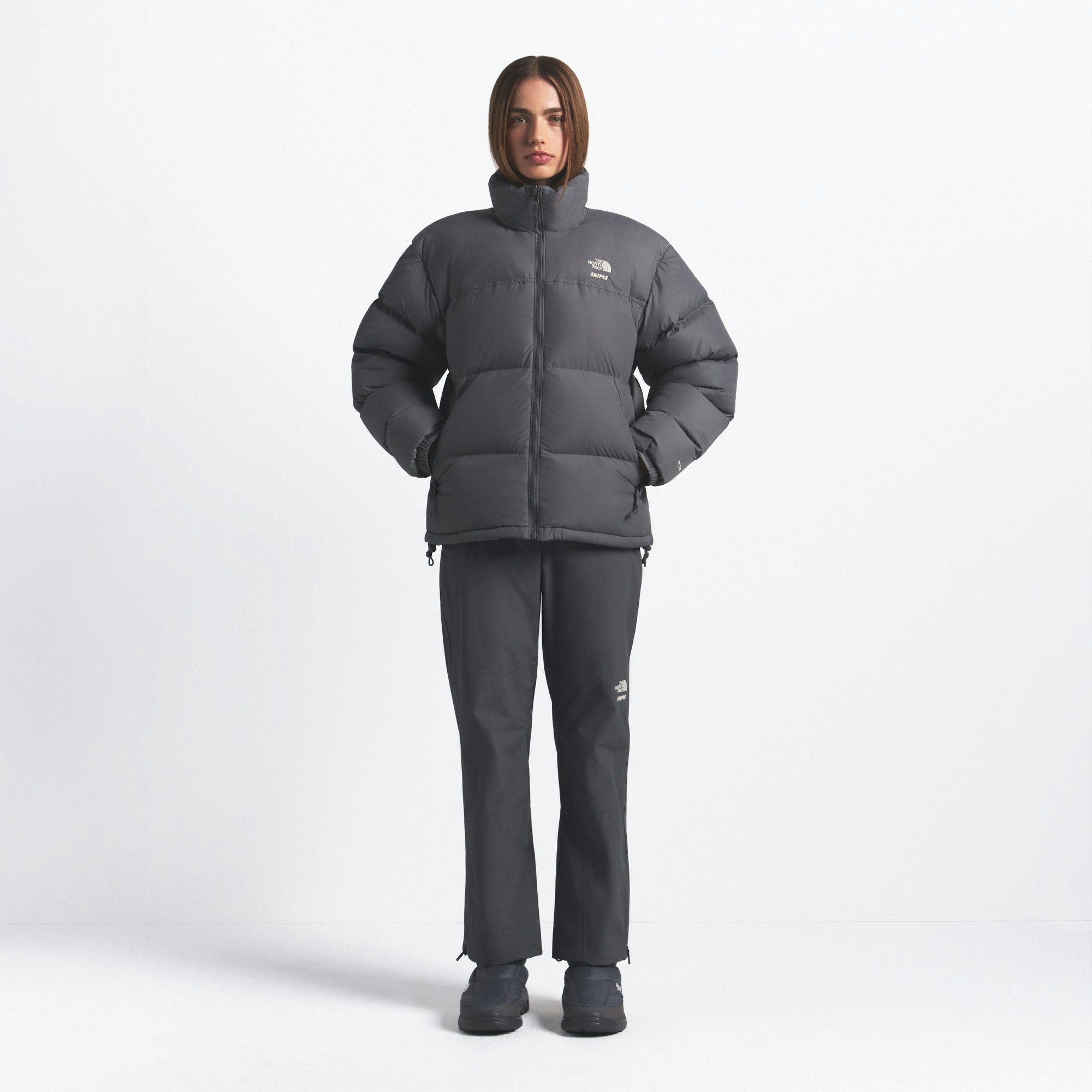 THE NORTH FACE X SKIMS 1996 NUPTSE JACKET | GUNMETAL ON A MODEL FRONT VIEW @ | FOCUS: 0.0, 1.0, 0.9