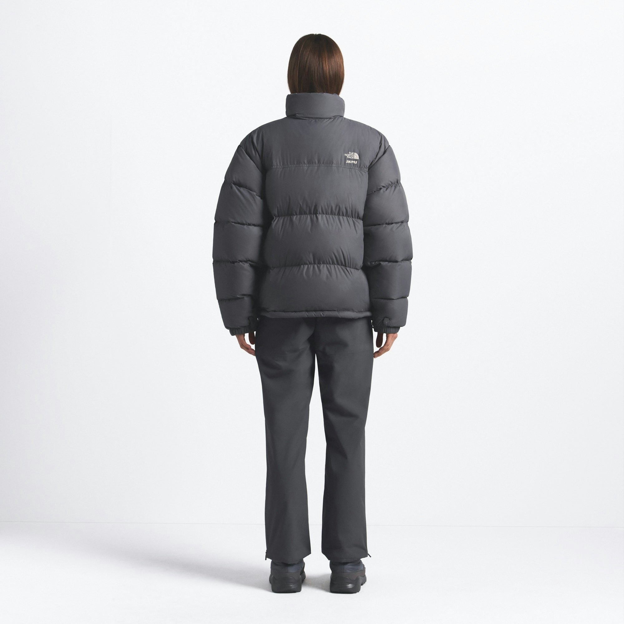 THE NORTH FACE X SKIMS 1996 NUPTSE JACKET | GUNMETAL ON A MODEL FRONT VIEW @ | FOCUS: 0.0, 1.0, 0.9