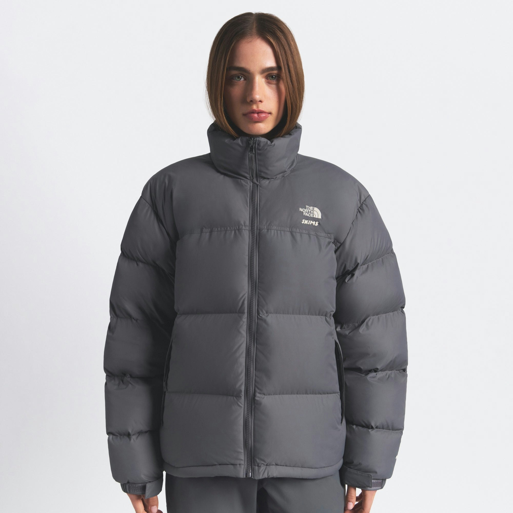 THE NORTH FACE X SKIMS 1996 NUPTSE JACKET | GUNMETAL ON A MODEL FRONT VIEW @ | FOCUS: 0.0, 1.0, 0.9