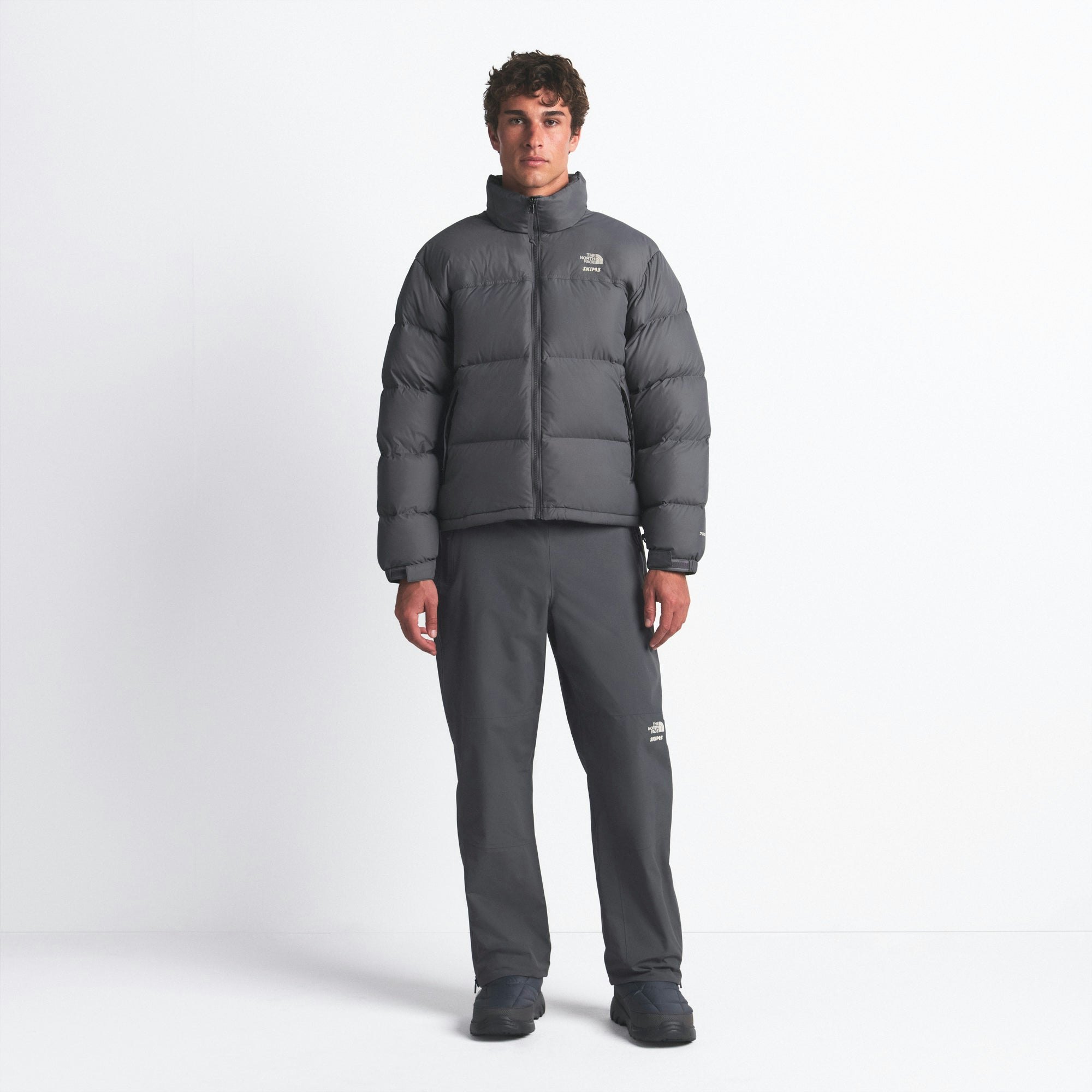 THE NORTH FACE X SKIMS 1996 NUPTSE JACKET | GUNMETAL ON A MODEL FRONT VIEW @ | FOCUS: 0.0, 1.0, 0.9