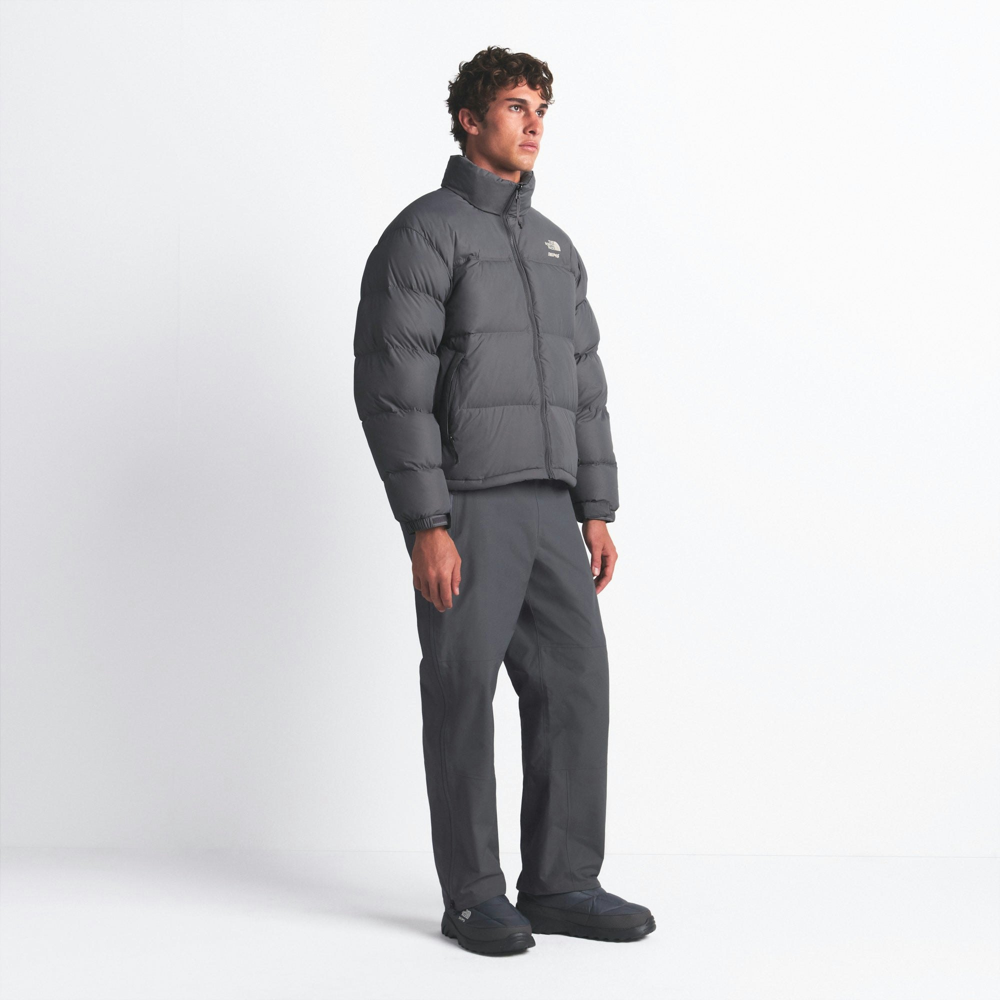 THE NORTH FACE X SKIMS 1996 NUPTSE JACKET | GUNMETAL ON A MODEL FRONT VIEW @ | FOCUS: 0.0, 1.0, 0.9