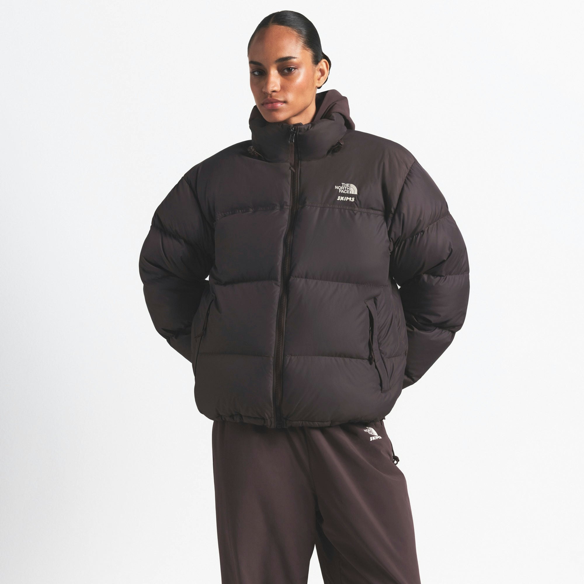 THE NORTH FACE X SKIMS 1996 NUPTSE JACKET | PHOENIX ON A MODEL FRONT VIEW @ | FOCUS: 0.0, 1.0, 0.9
