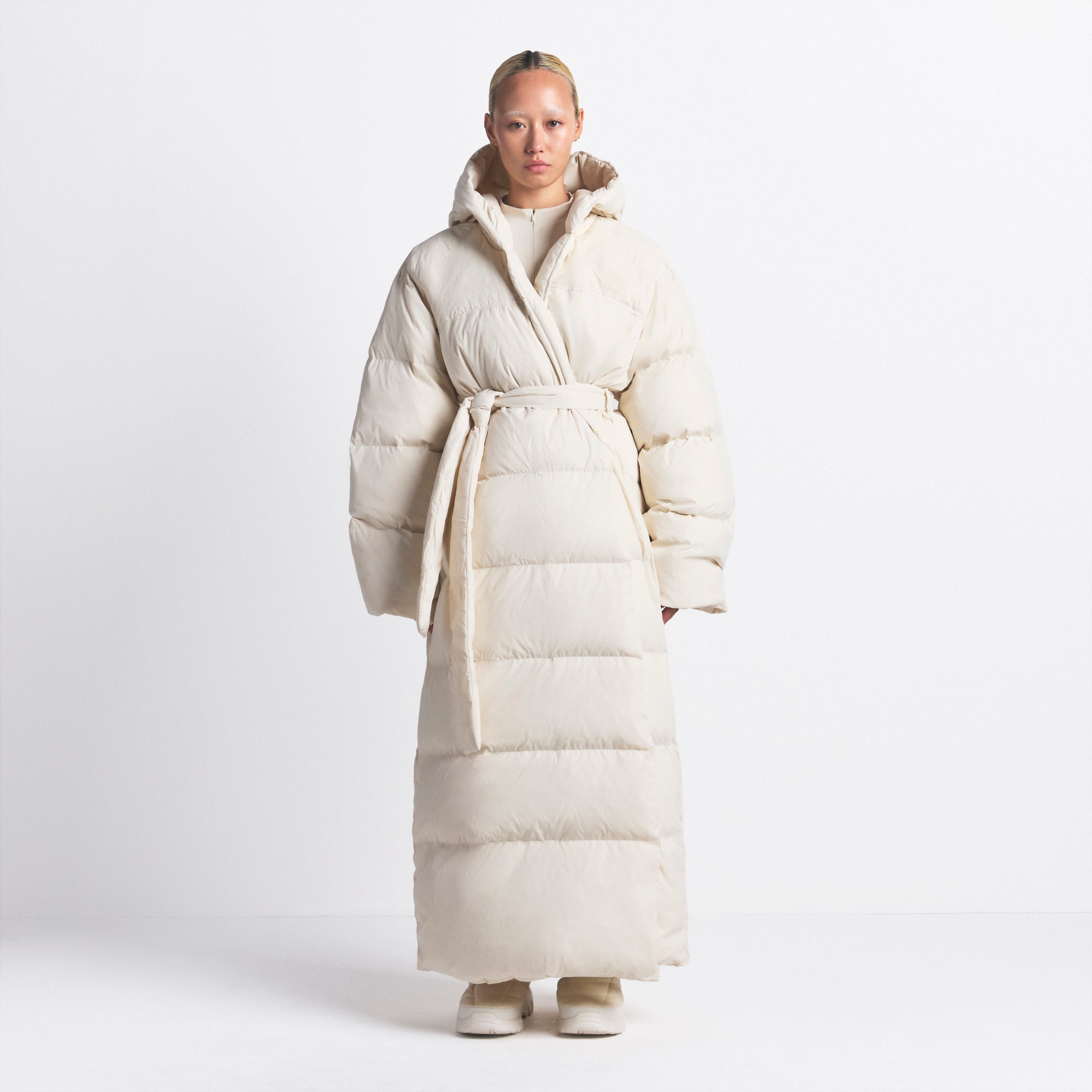 THE NORTH FACE X SKIMS NUPTSE WRAP PARKA | BONE ON A MODEL FRONT VIEW @ | FOCUS: 0.0, 1.0, 0.9