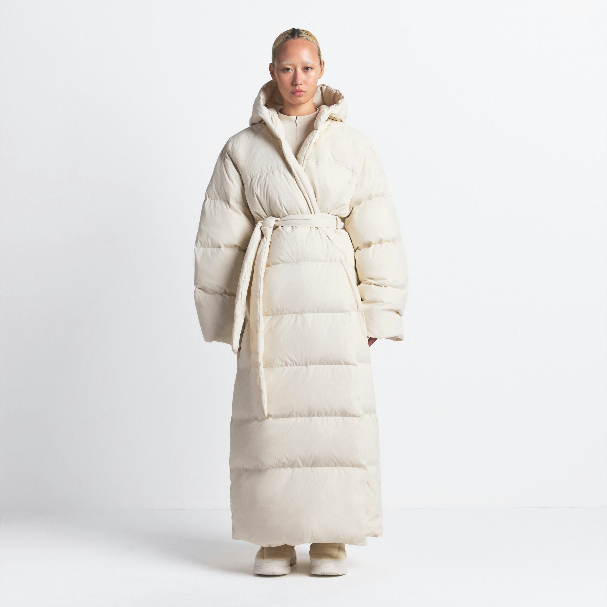 THE NORTH FACE X SKIMS NUPTSE WRAP PARKA | BONE ON A MODEL FRONT VIEW @ | FOCUS: 0.0, 1.0, 0.9
