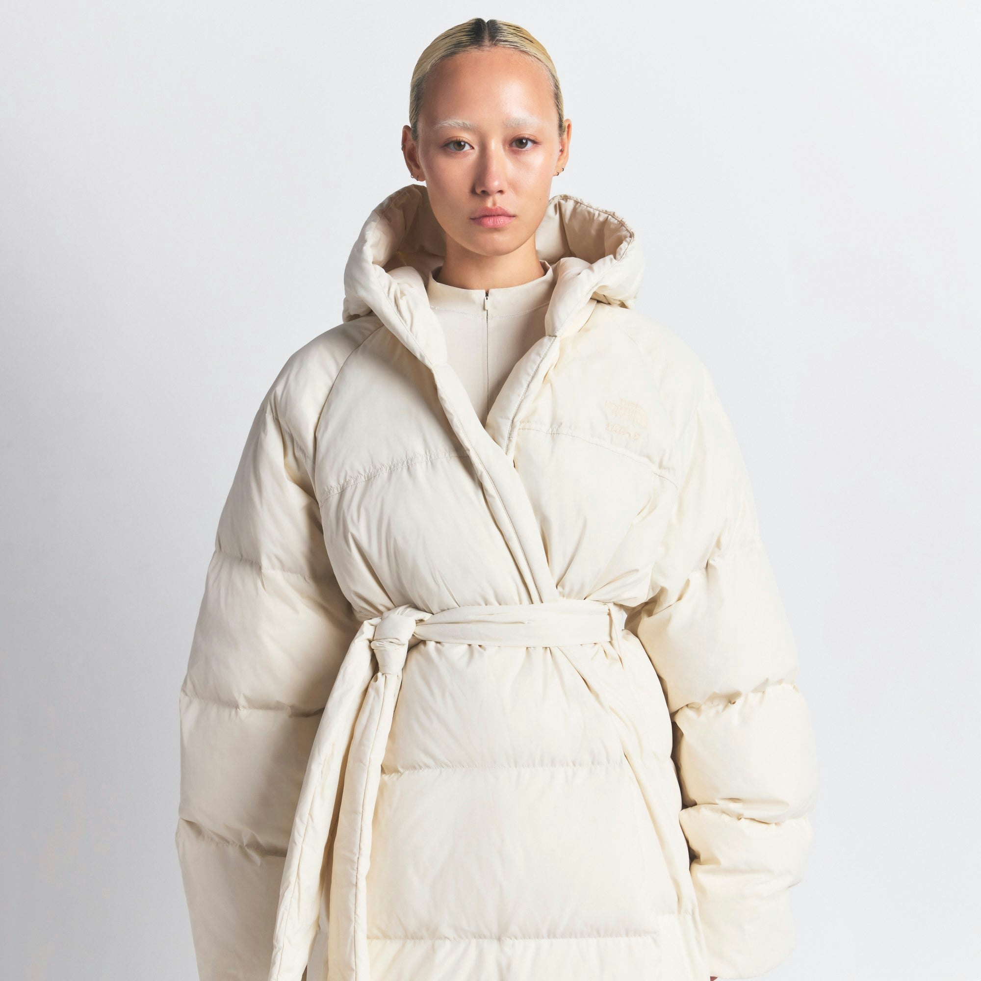 THE NORTH FACE X SKIMS NUPTSE WRAP PARKA | BONE ON A MODEL FRONT VIEW @ | FOCUS: 0.0, 1.0, 0.9