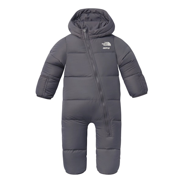 THE NORTH FACE X SKIMS BABY 1996 NUPTSE ONE-PIECE | GUNMETAL FLAT ON A WHITE BACKGROUND | FLT