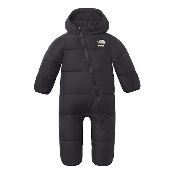 THE NORTH FACE X SKIMS BABY 1996 NUPTSE ONE-PIECE | ONYX FLAT ON A WHITE BACKGROUND | FLT