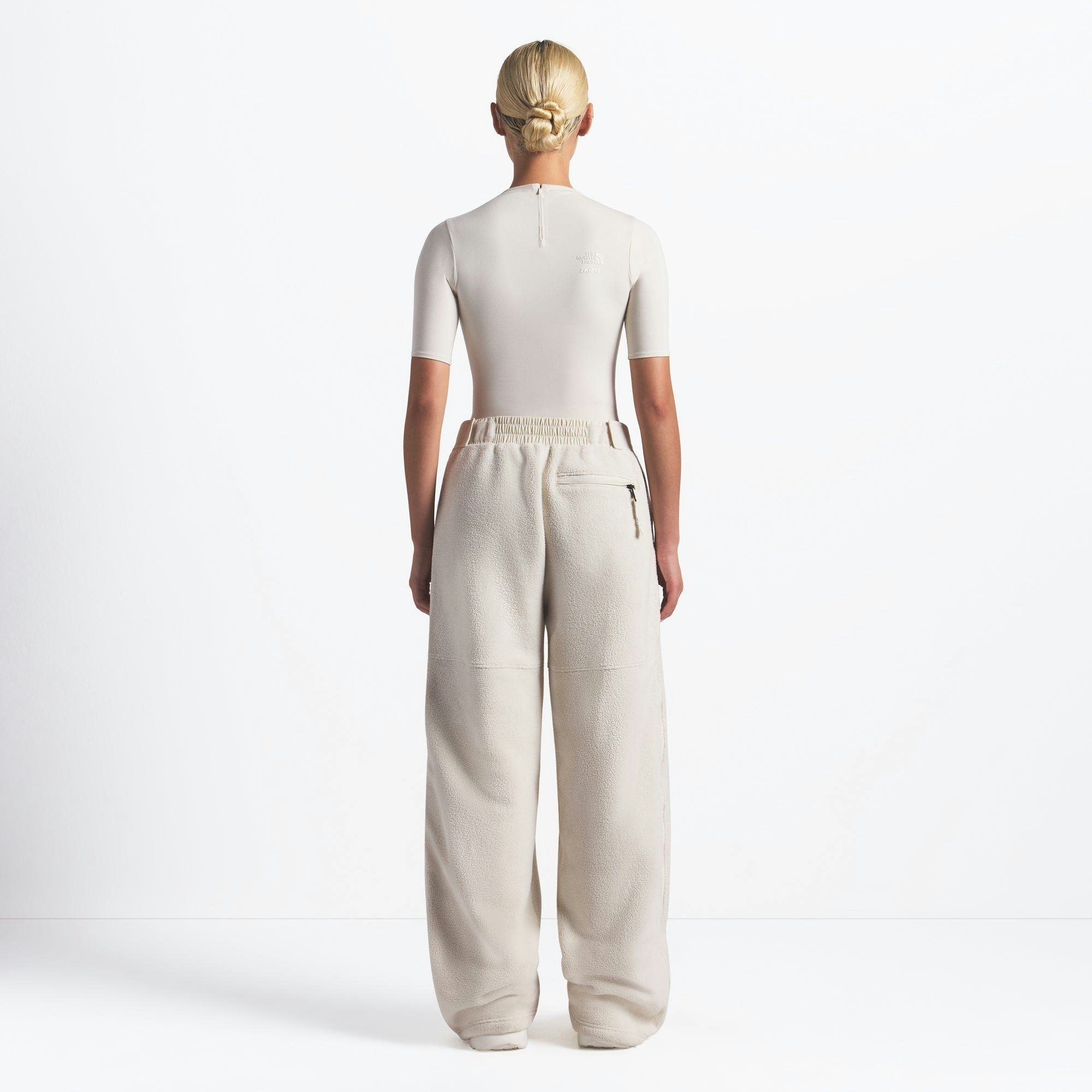 THE NORTH FACE X SKIMS 1995 DENALI FLEECE STRAIGHT LEG PANT | BONE ON A MODEL FRONT VIEW @ | FOCUS: 0.0, 1.0, 0.9