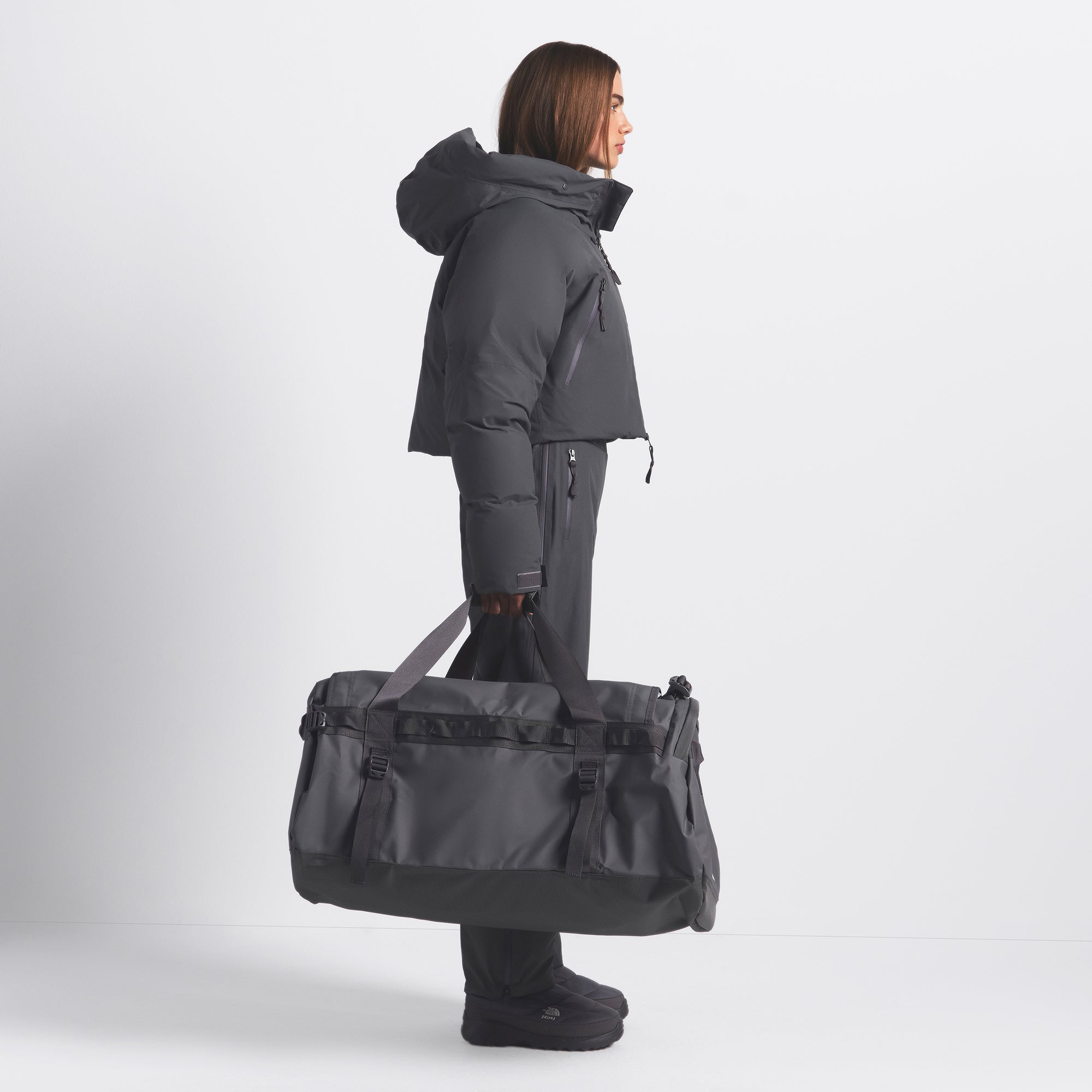 THE NORTH FACE X SKIMS LARGE BASE CAMP DUFFLE BAG | GUNMETAL ON A MODEL FRONT VIEW @ | FOCUS: 0.0, 1.0, 0.9