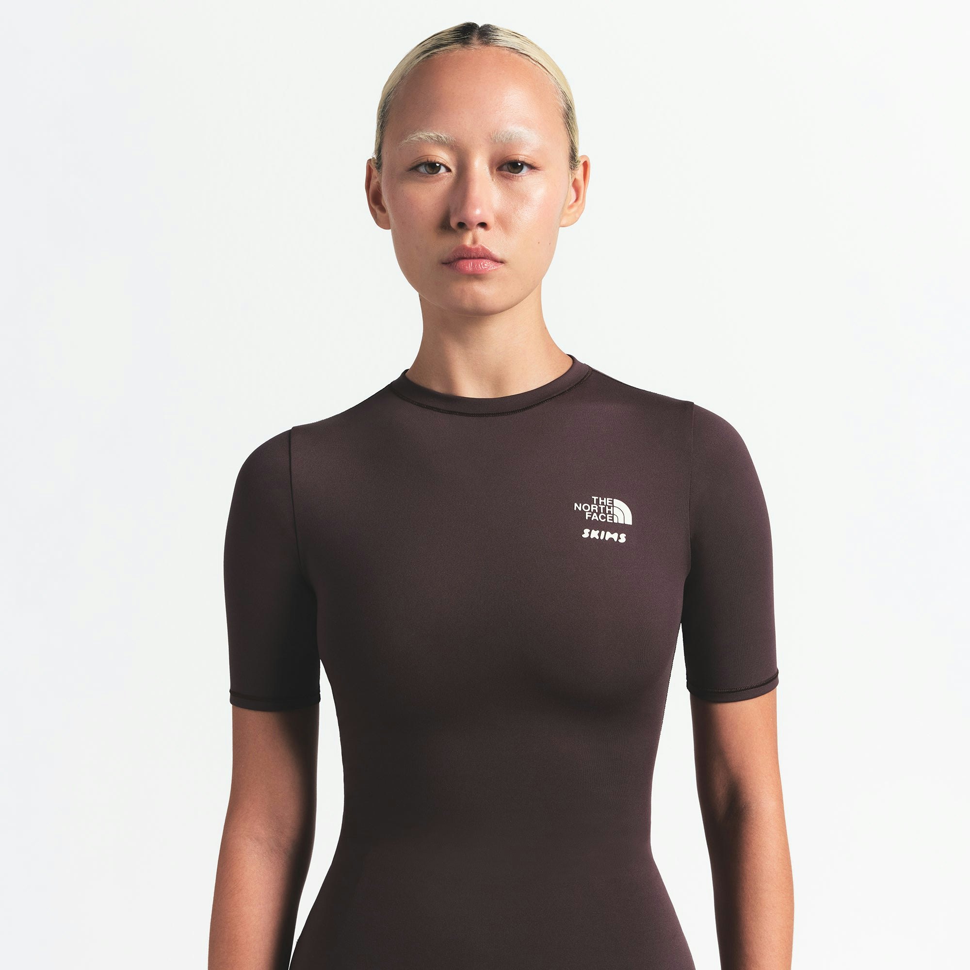 THE NORTH FACE X SKIMS REFINA SHORT SLEEVE TOP | PHOENIX ON A MODEL FRONT VIEW @ | FOCUS: 0.0, 1.0, 0.9