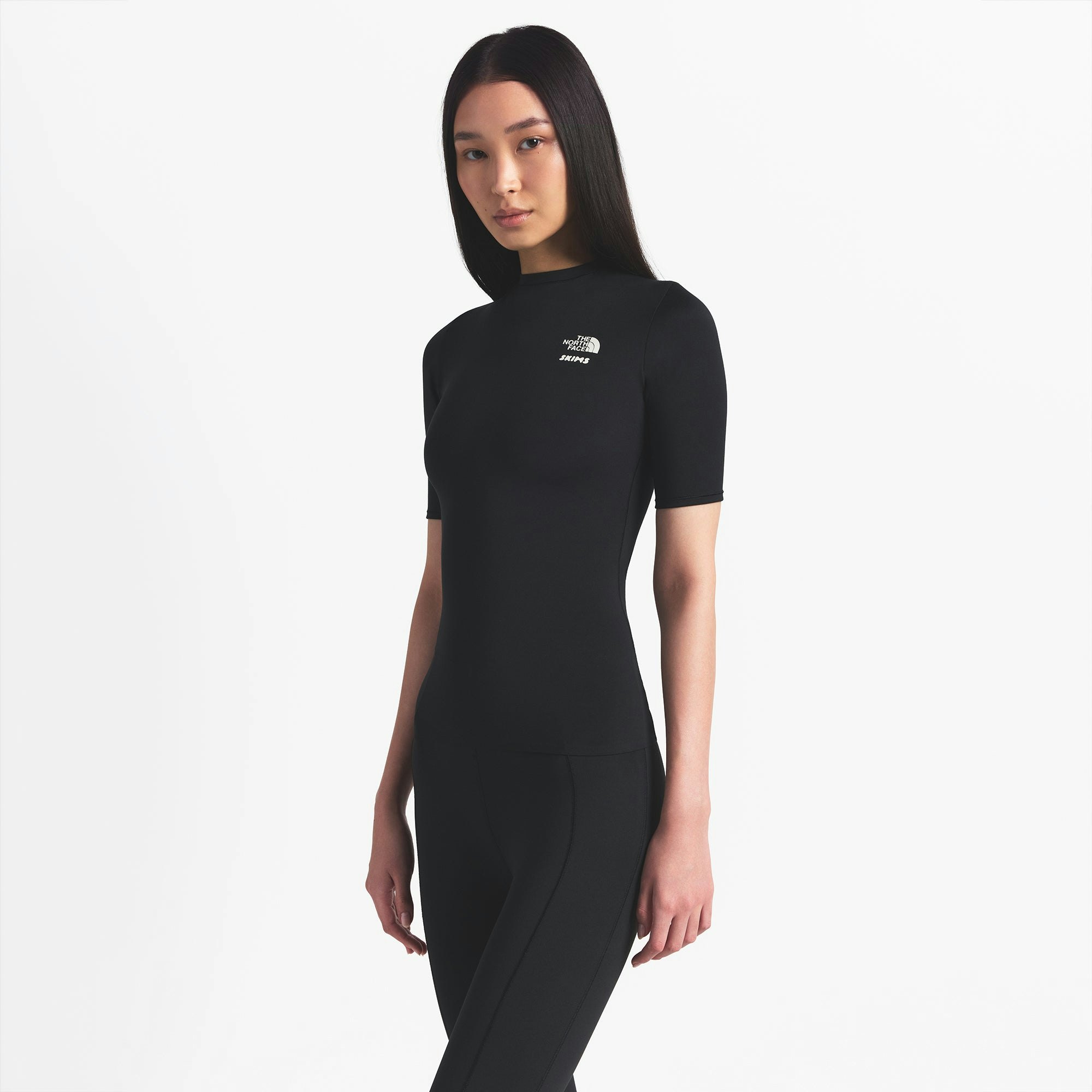 THE NORTH FACE X SKIMS REFINA SHORT SLEEVE TOP | ONYX ON A MODEL FRONT VIEW @ | FOCUS: 0.0, 1.0, 0.9