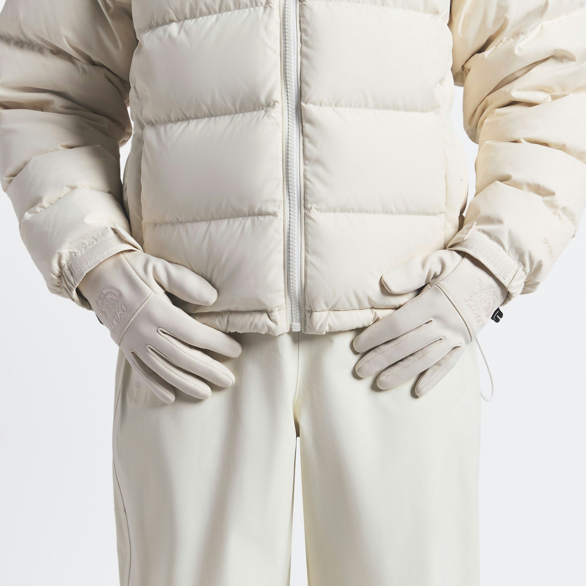 THE NORTH FACE X SKIMS GLOVES | BONE ON A MODEL FRONT VIEW @ | FOCUS: 0.0, 1.0, 0.9