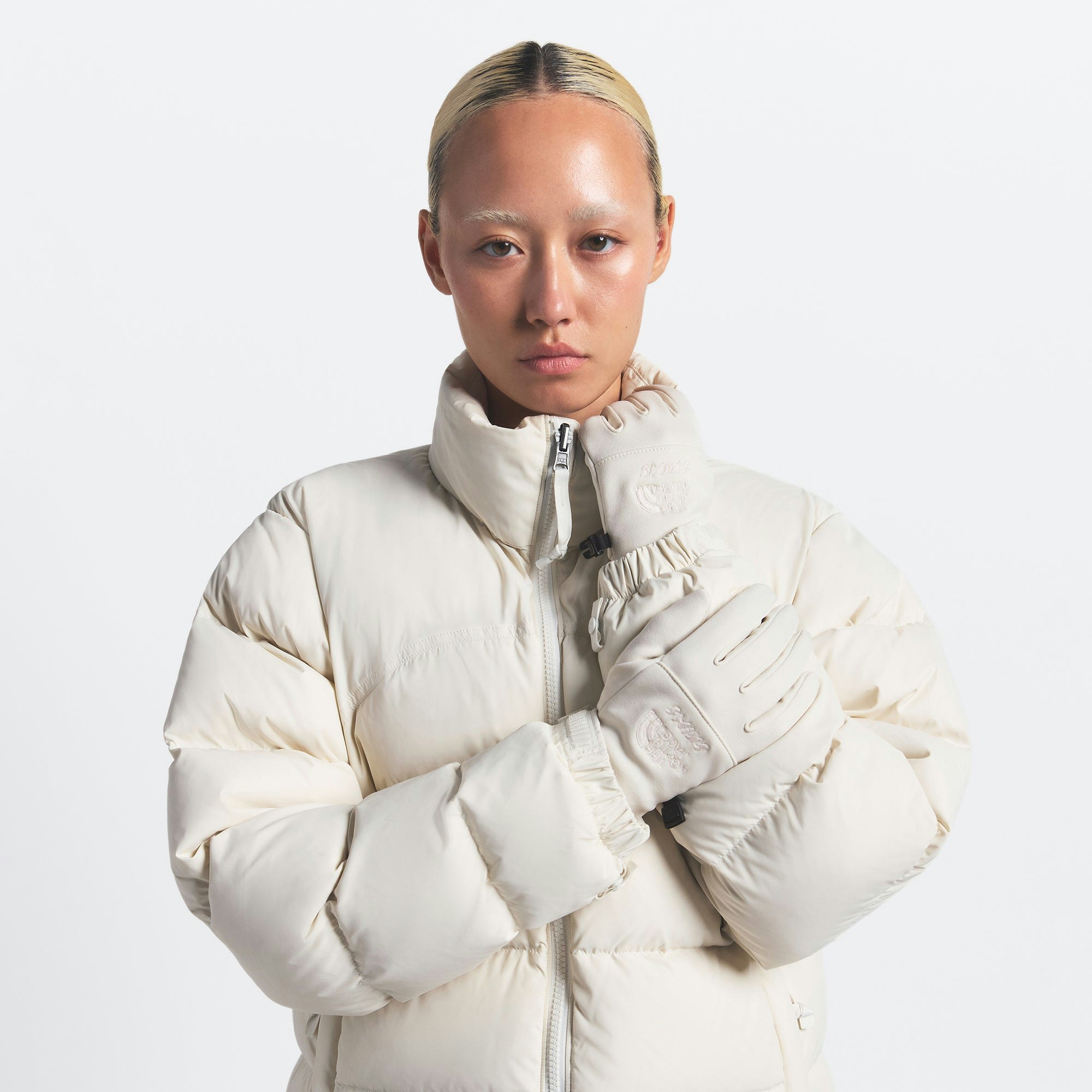 THE NORTH FACE X SKIMS GLOVES | BONE ON A MODEL FRONT VIEW @ | FOCUS: 0.0, 1.0, 0.9