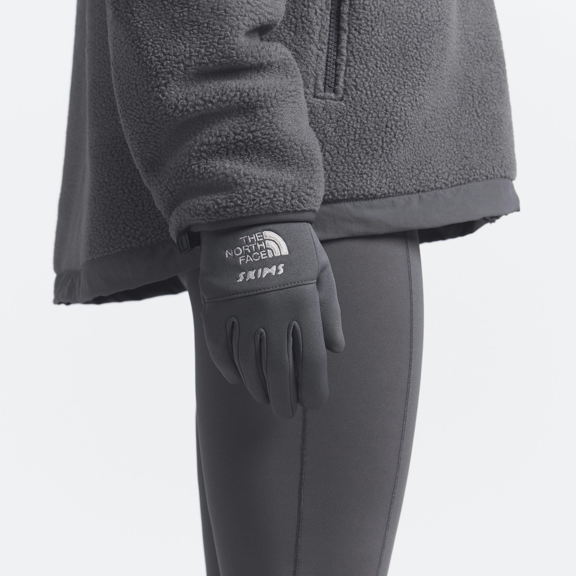 THE NORTH FACE X SKIMS GLOVES | GUNMETAL ON A MODEL FRONT VIEW @ | FOCUS: 0.0, 1.0, 0.9