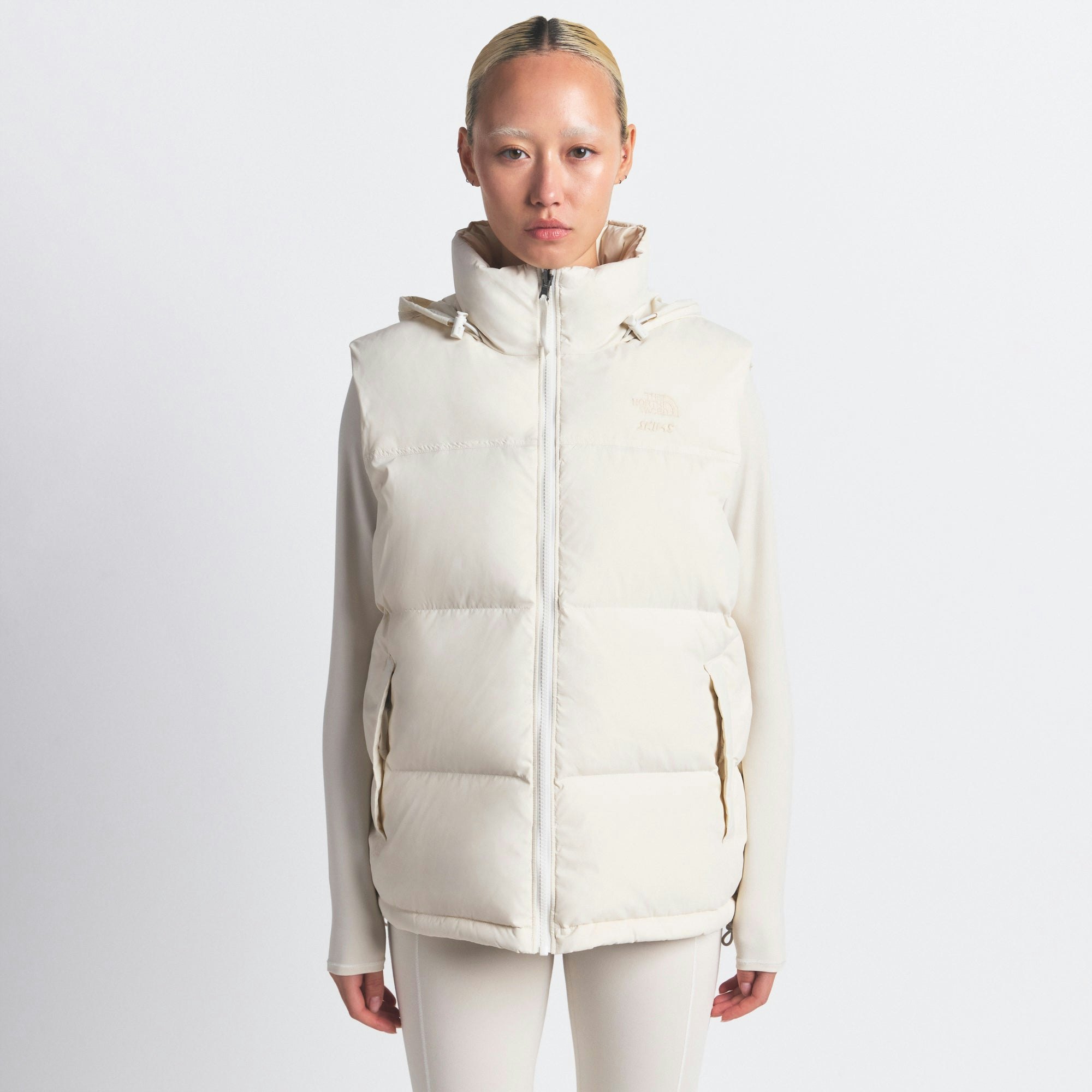 THE NORTH FACE X SKIMS 1996 NUPTSE VEST | BONE ON A MODEL FRONT VIEW @ | FOCUS: 0.0, 1.0, 0.9