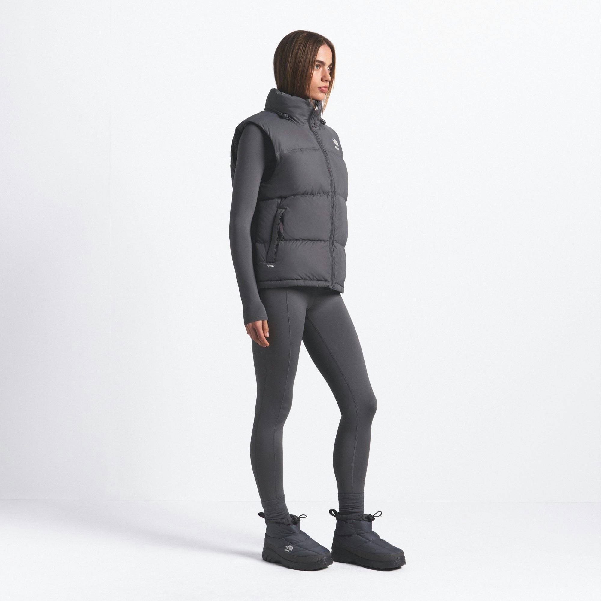 THE NORTH FACE X SKIMS 1996 NUPTSE VEST | GUNMETAL ON A MODEL FRONT VIEW @ | FOCUS: 0.0, 1.0, 0.9