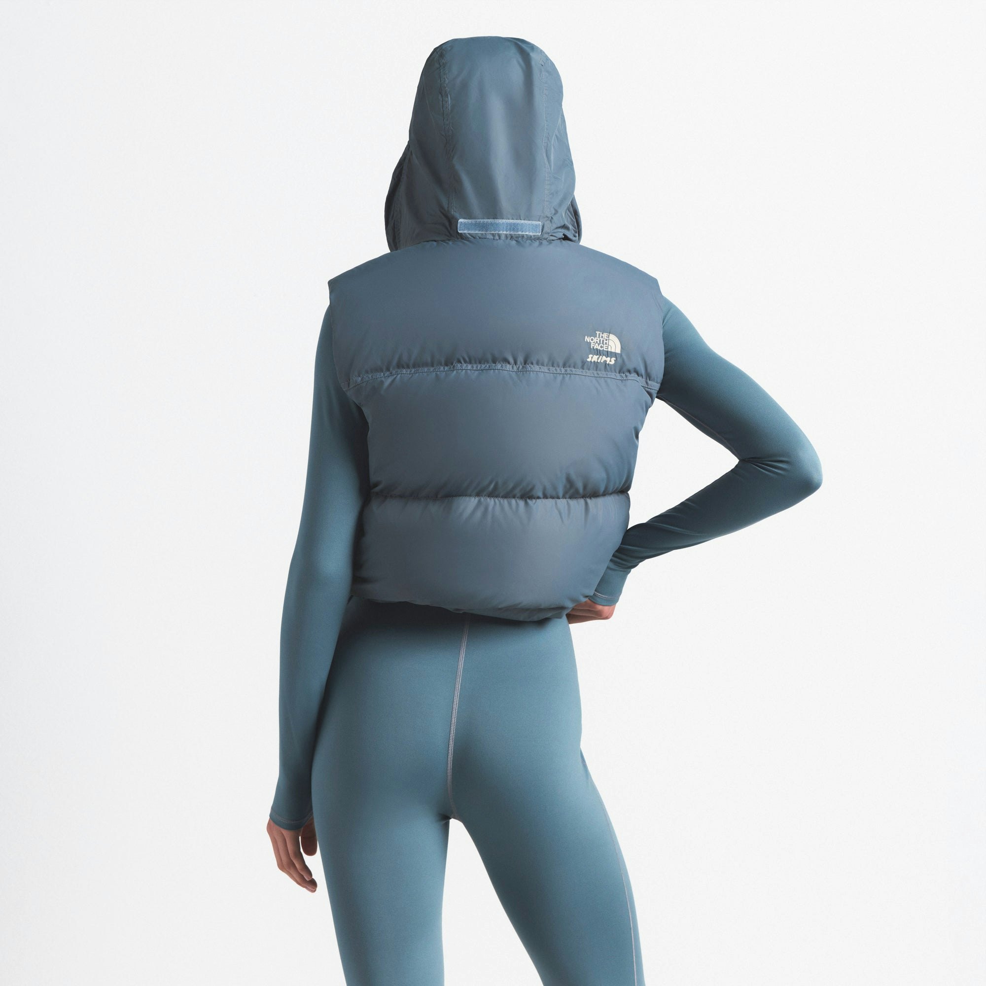 THE NORTH FACE X SKIMS 1996 NUPTSE VEST | KYANITE ON A MODEL FRONT VIEW @ | FOCUS: 0.0, 1.0, 0.9