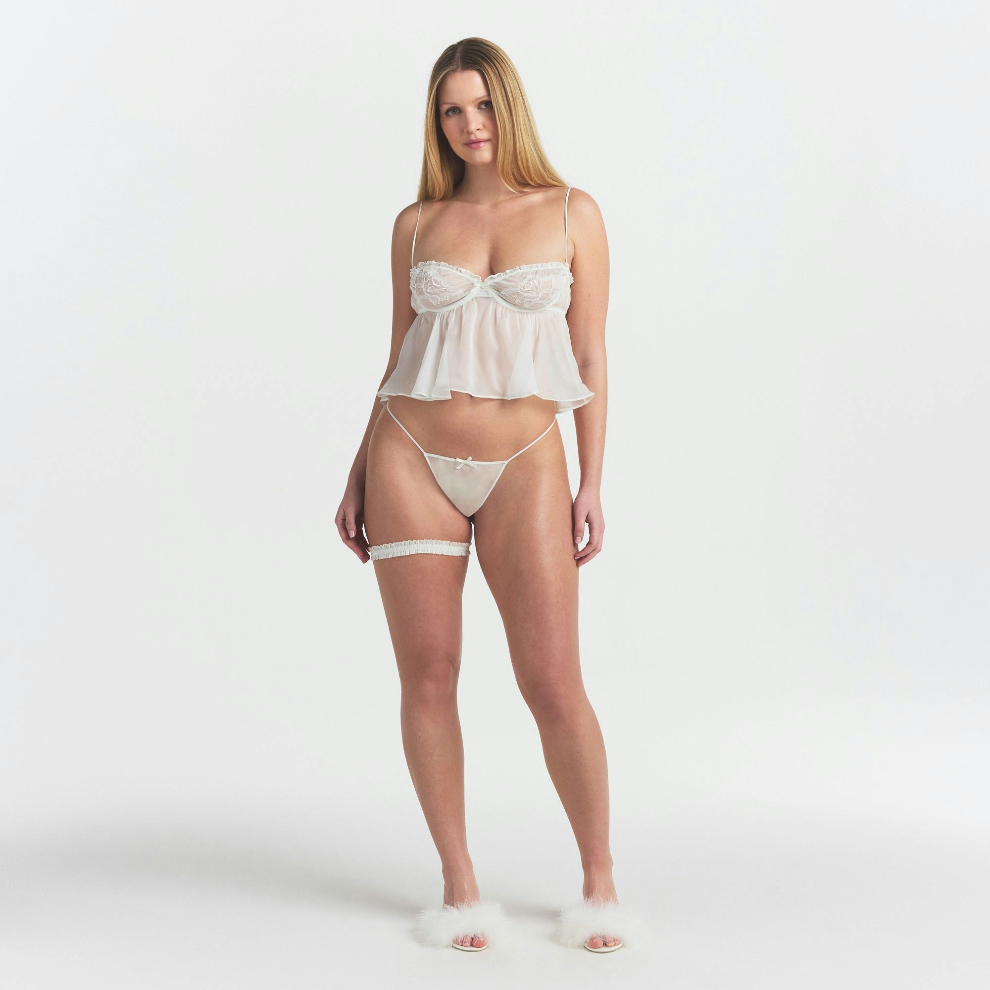 SKIMS ROMANCE GARTER | IVORY ON A MODEL FRONT VIEW @ | FOCUS: 0.0, 1.0, 0.9