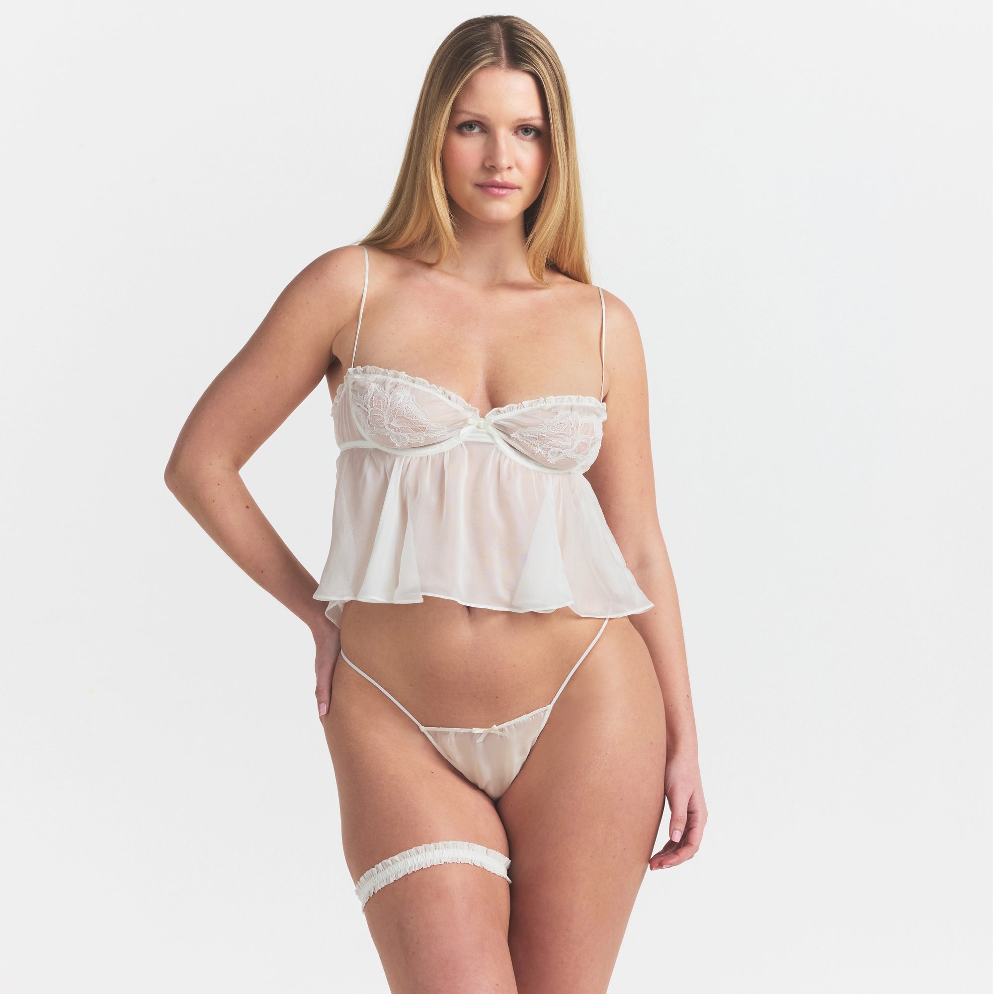 SKIMS ROMANCE GARTER | IVORY ON A MODEL SIDE VIEW @ | FOCUS: 0.0, 1.0, 0.9