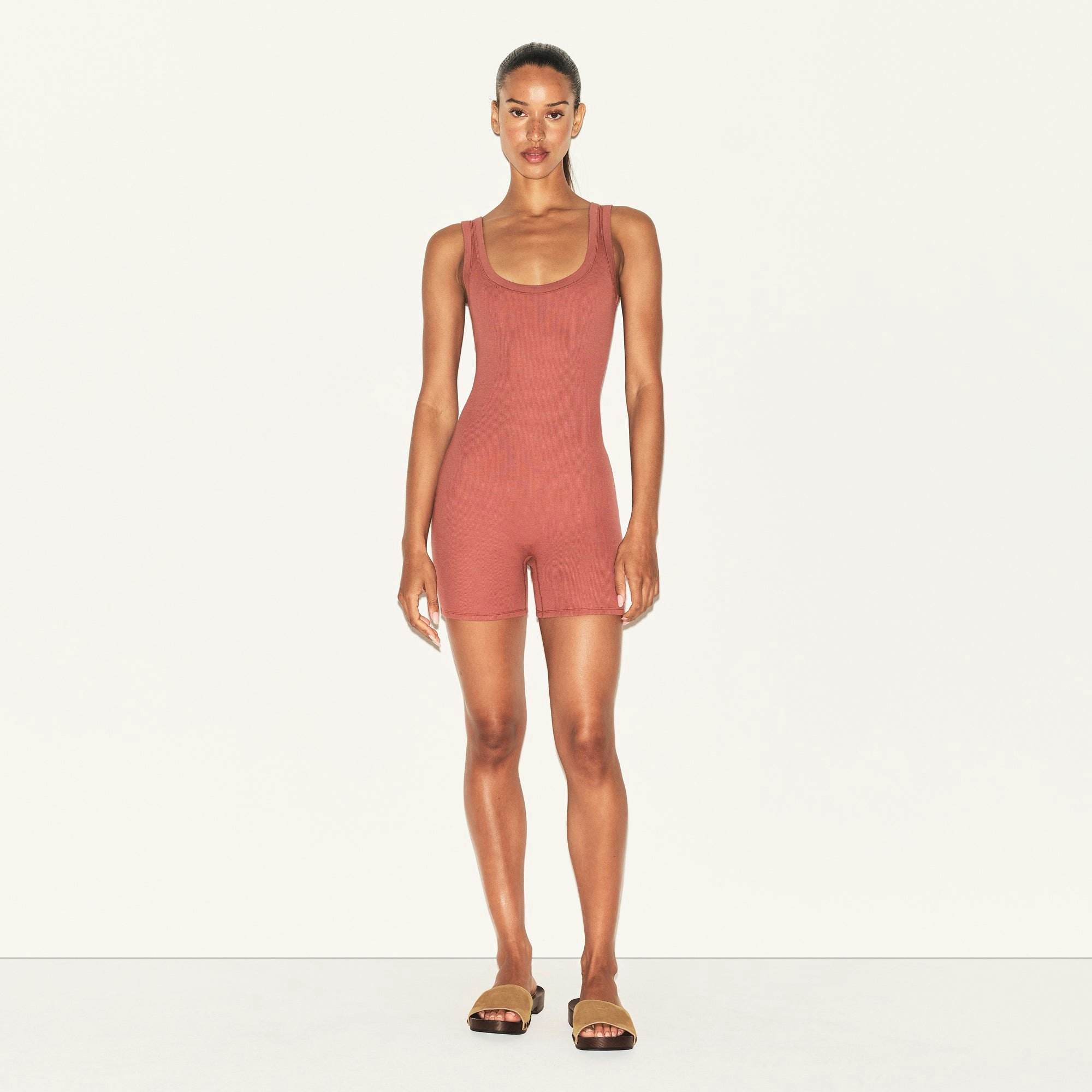 COTTON RIB ONESIE | REDWOOD ON A MODEL FRONT VIEW | FOCUS: 0.0, 1.0, 0.9