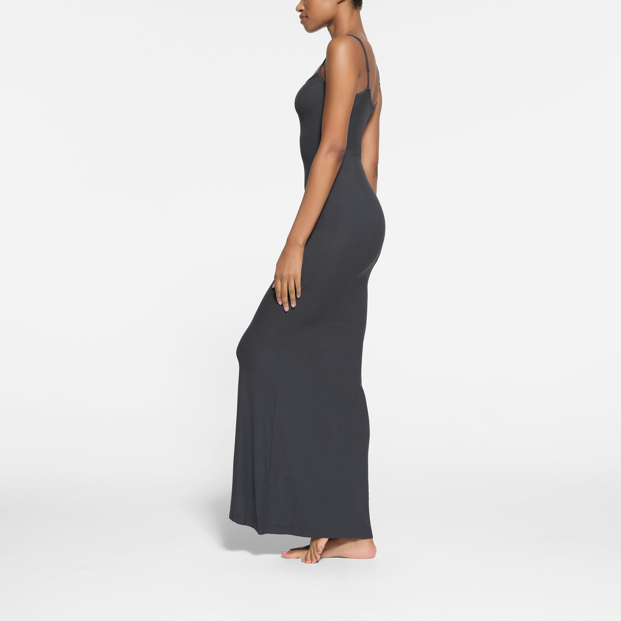 SOFT LOUNGE LONG SLIP DRESS WORN BY A MODEL IN SIDE VIEW
