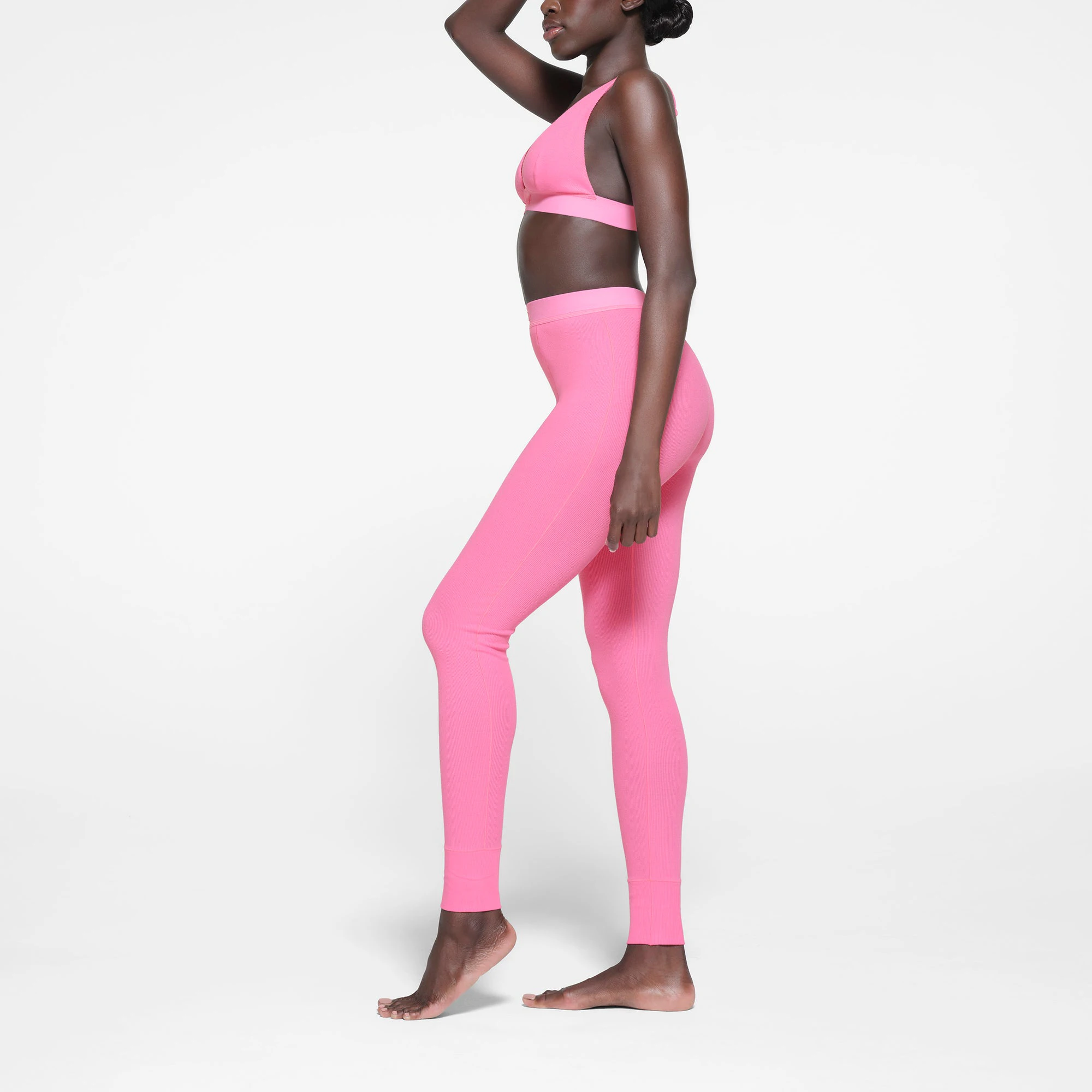 COTTON RIB LEGGING | SUGAR PINK ON A MODEL SIDE VIEW