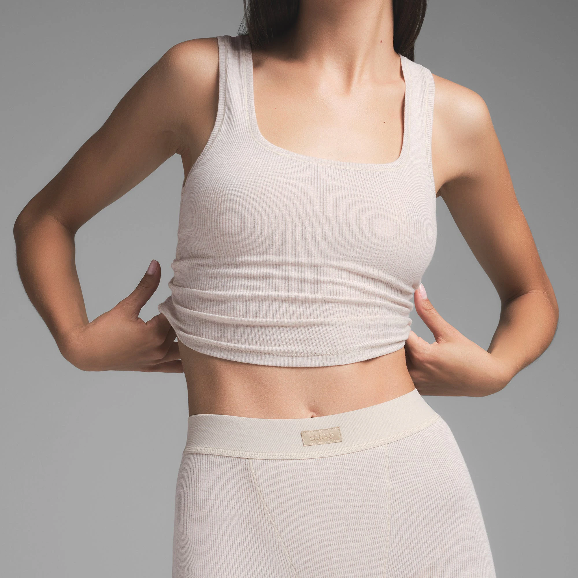 COTTON RIB TANK | HEATHER OATMEAL ON A MODEL SIDE VIEW