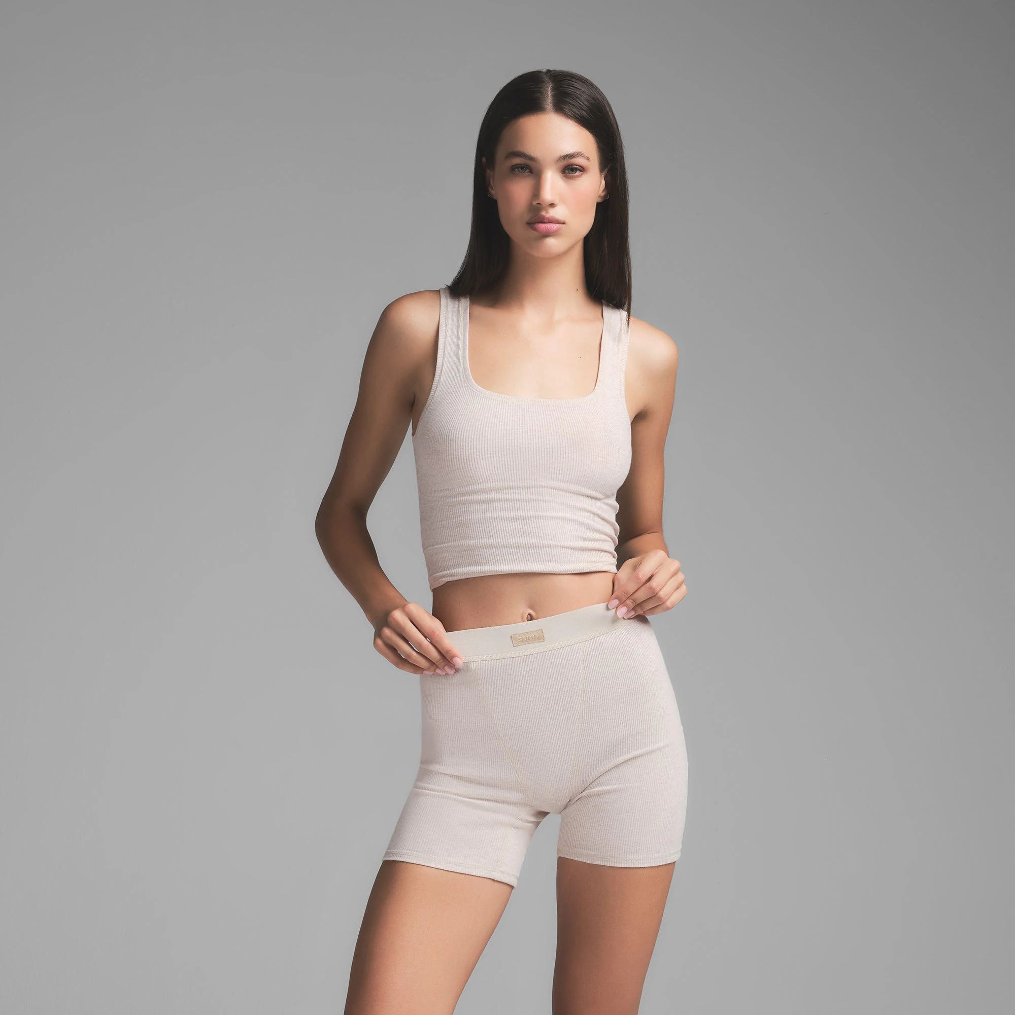 COTTON RIB TANK | HEATHER OATMEAL ON A MODEL SIDE VIEW