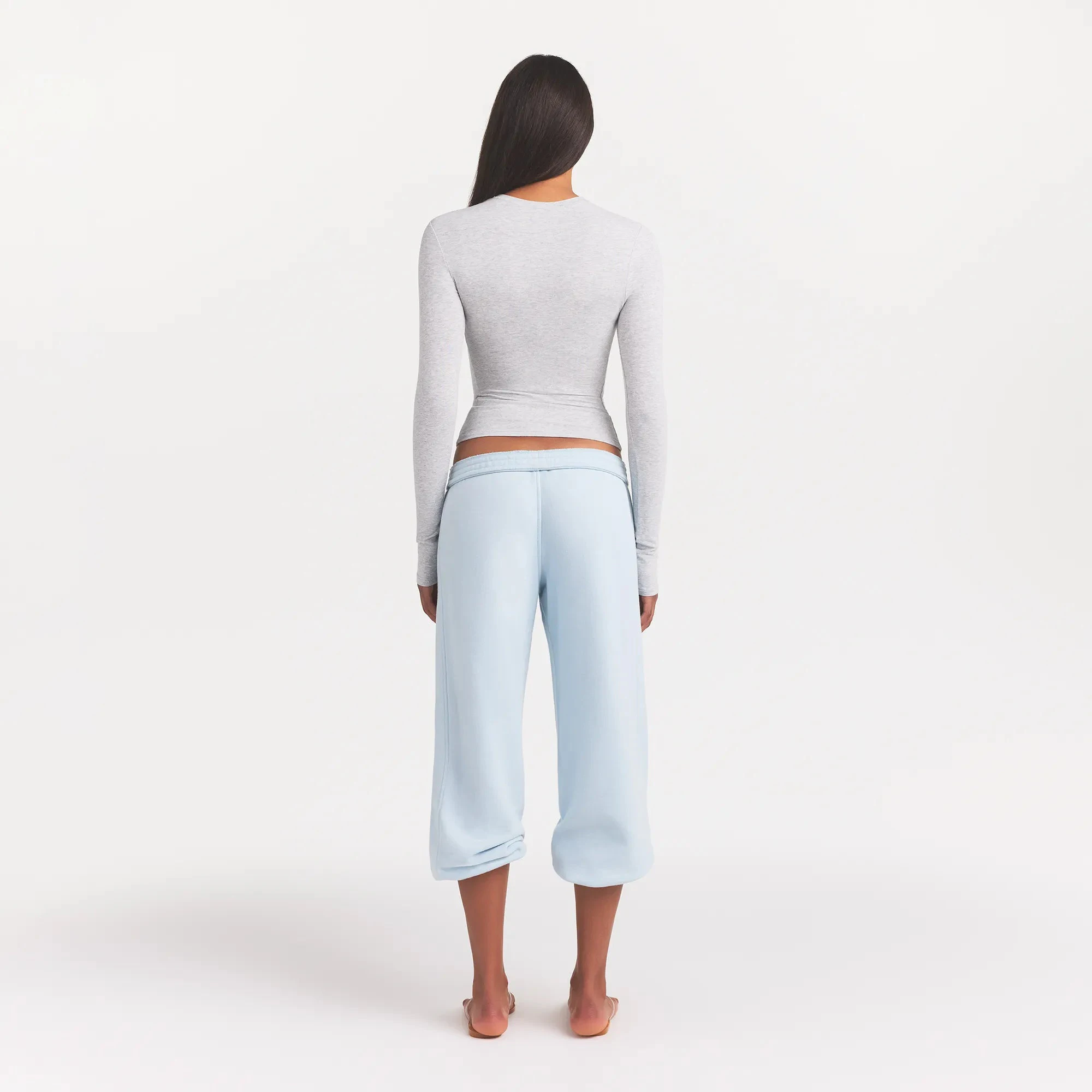 COTTON JERSEY LONG SLEEVE T-SHIRT | LIGHT HEATHER GREY ON A MODEL BACK VIEW
