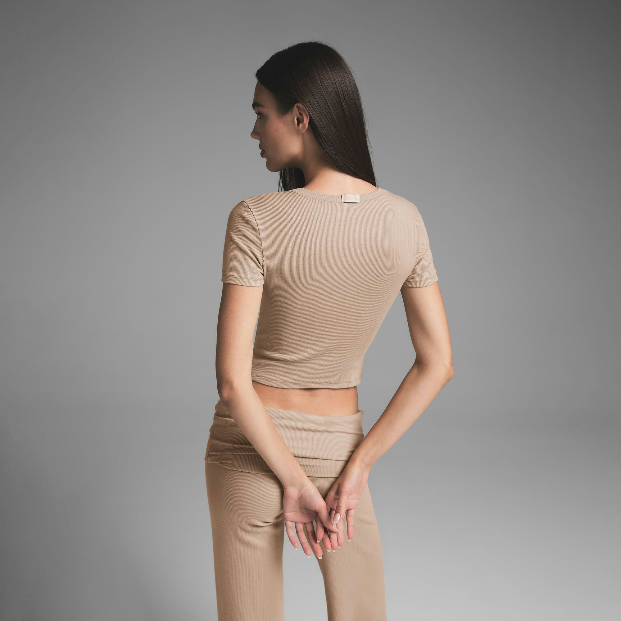 COTTON RIB T-SHIRT | LATTE ON A MODEL BACK VIEW | FOCUS: 0.0, 1.0, 0.9