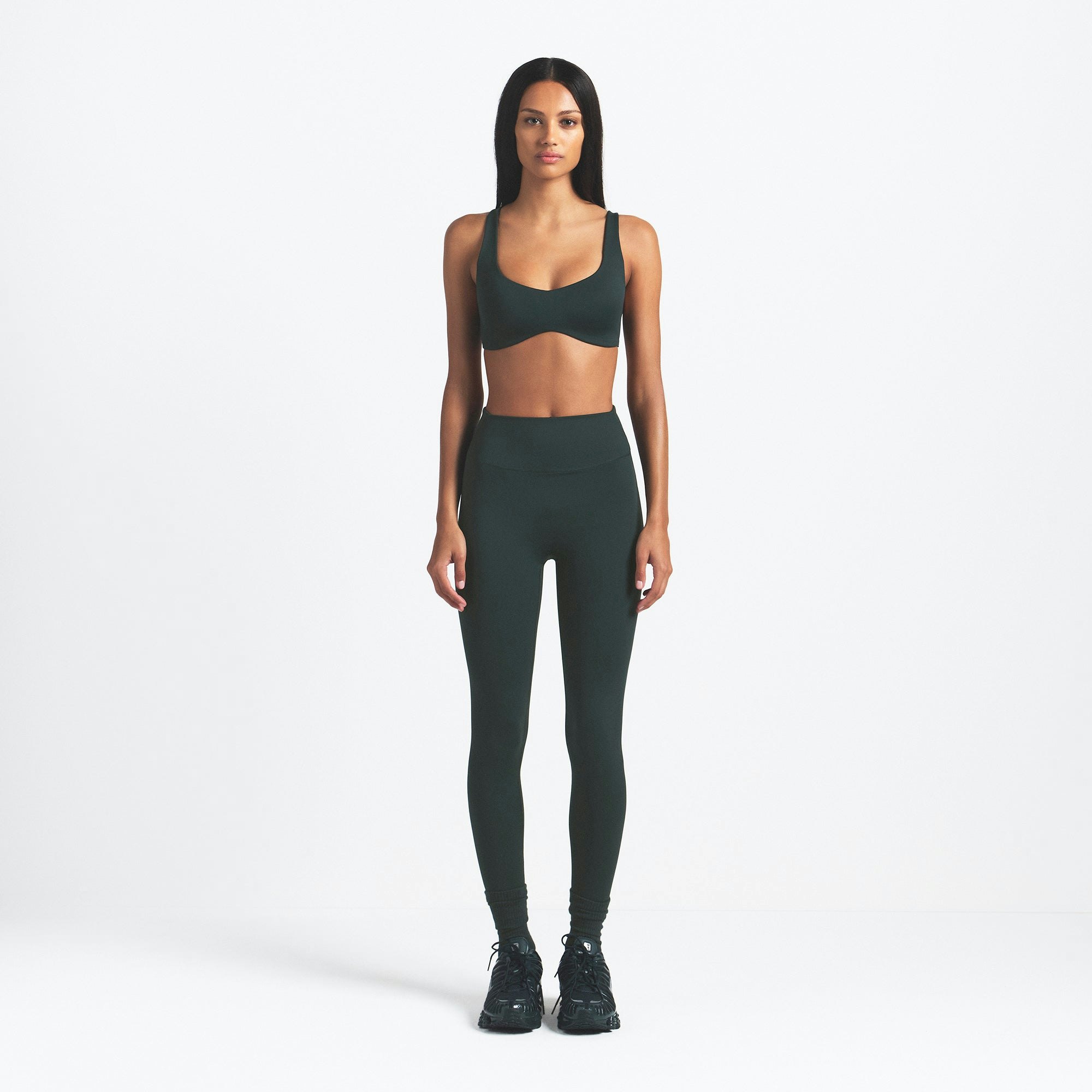 NikeSKIMS MATTE SHAPING SCOOP BRA | DARK TEAL ON A MODEL FRONT VIEW @ | FOCUS: 0.0, 1.0, 0.9