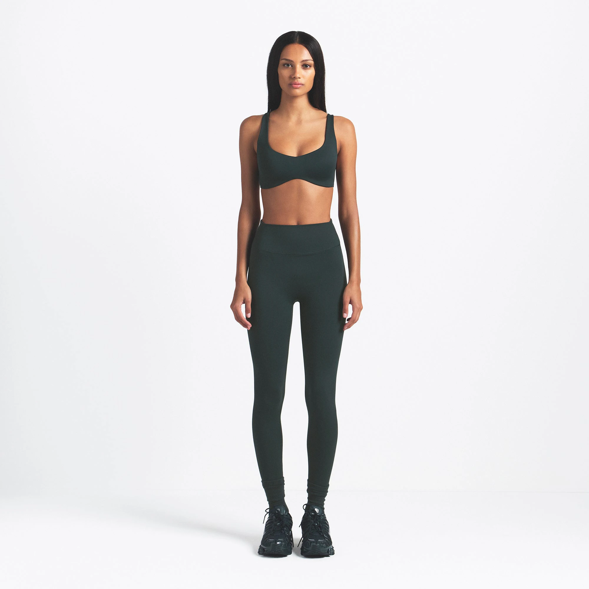 NikeSKIMS MATTE SHAPING SCOOP BRA | DARK TEAL ON A MODEL FRONT VIEW @ | FOCUS: 0.0, 1.0, 0.9