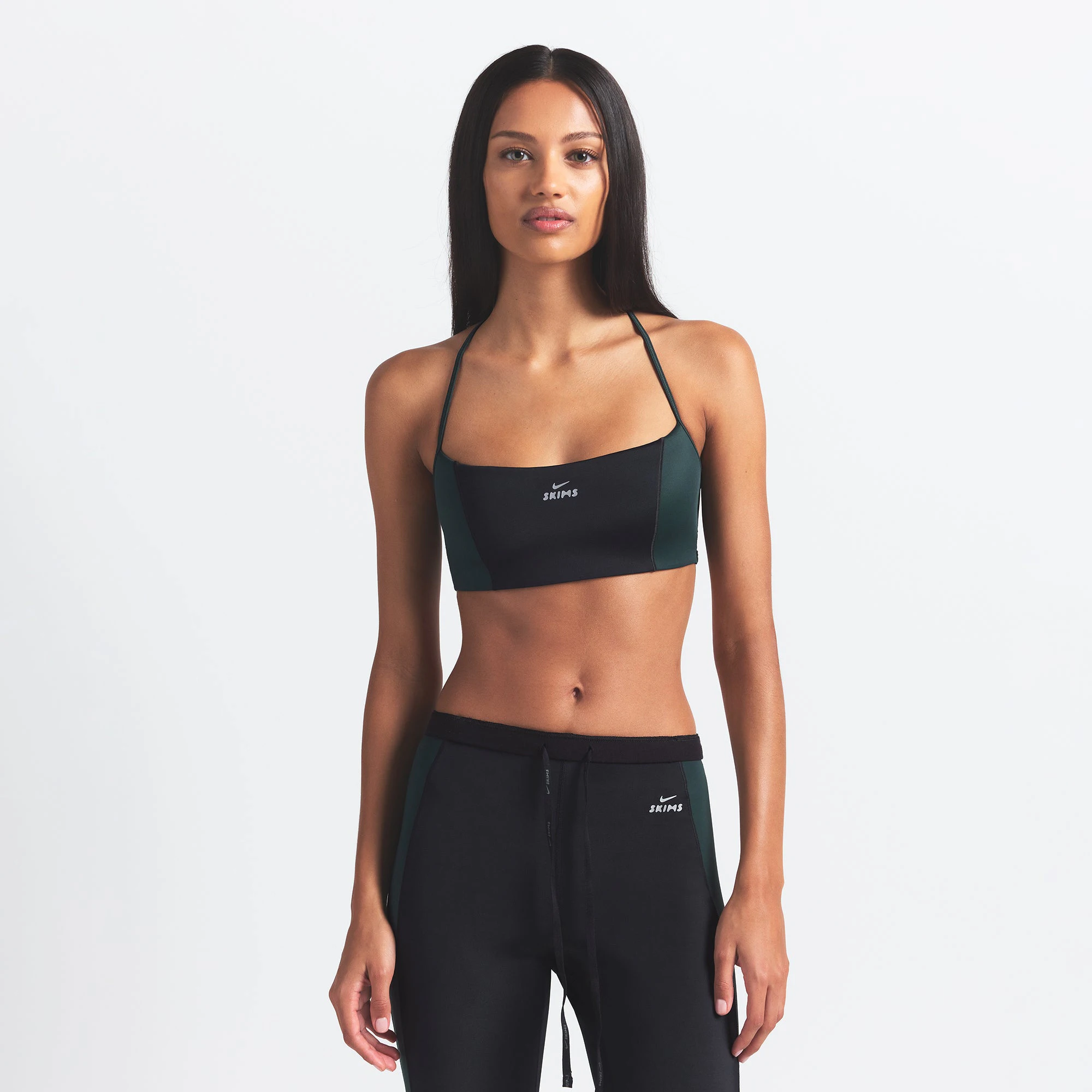 NikeSKIMS SHINE MICRO SCOOP BRA | OBSIDIAN AND DARK TEAL ON A MODEL FRONT VIEW @ | FOCUS: 0.0, 1.0, 0.9