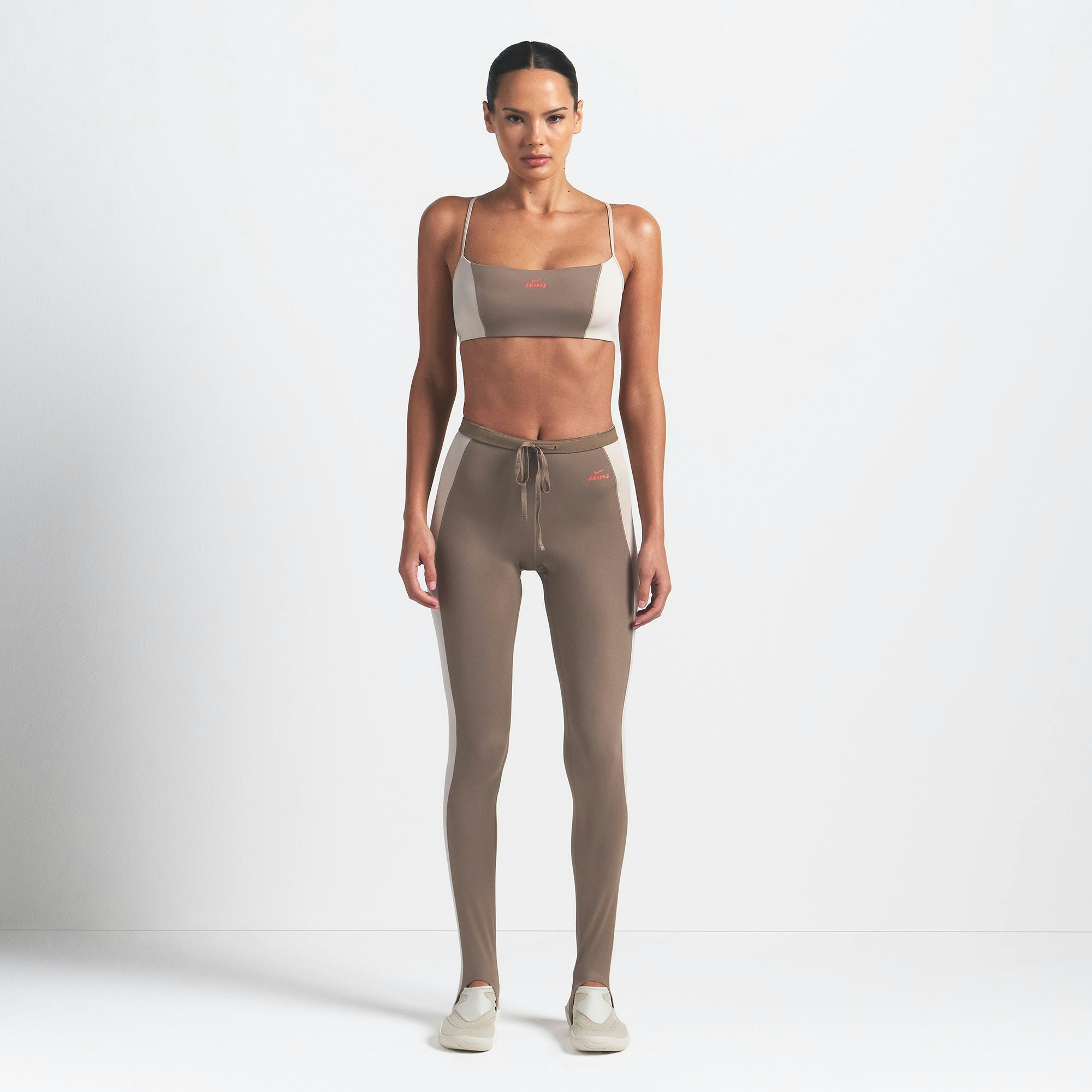 NikeSKIMS SHINE MICRO SCOOP BRA | TRUFFLE AND STONE ON A MODEL FRONT VIEW @ | FOCUS: 0.0, 1.0, 0.9