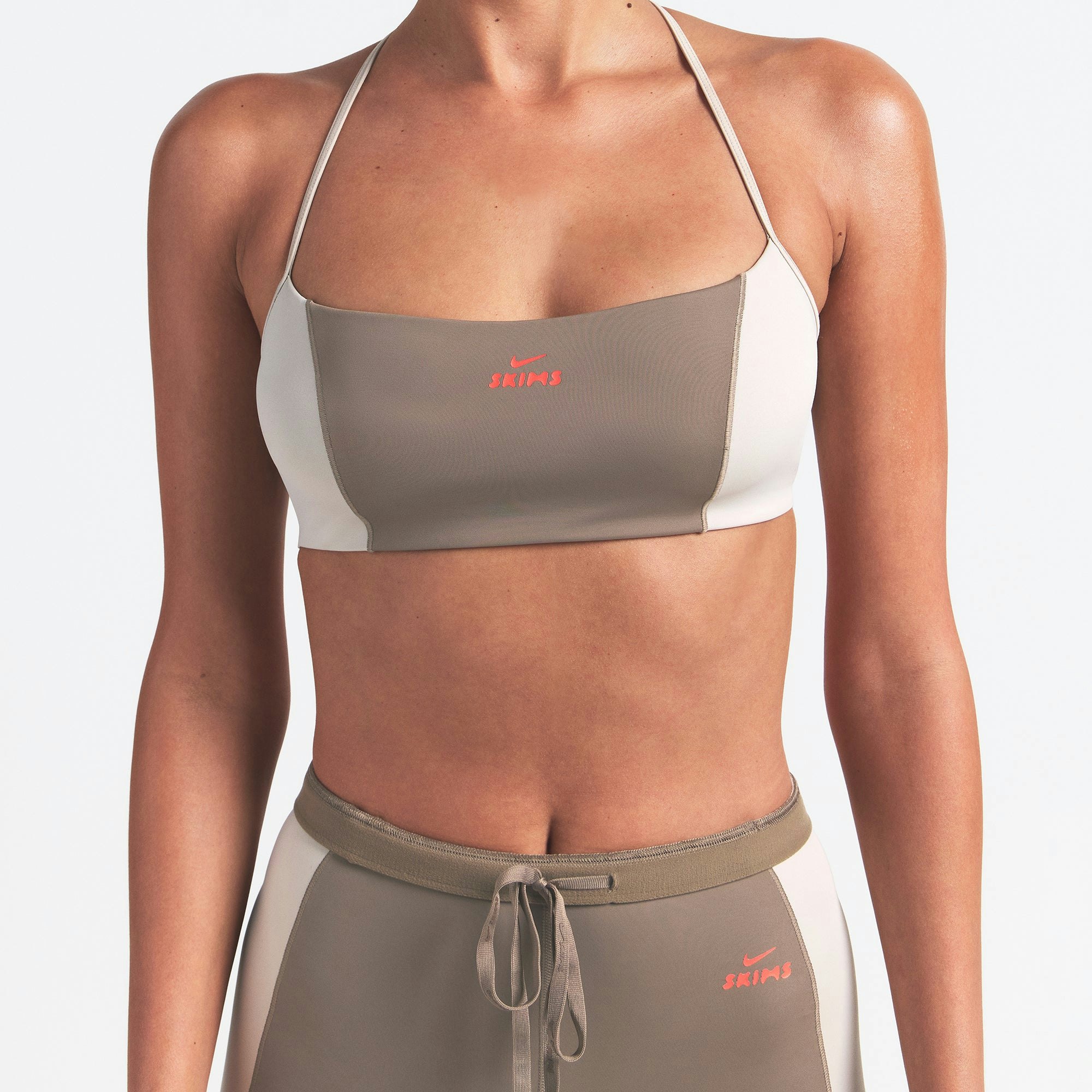 NikeSKIMS SHINE MICRO SCOOP BRA | TRUFFLE AND STONE ON A MODEL FRONT VIEW @ | FOCUS: 0.0, 1.0, 0.9