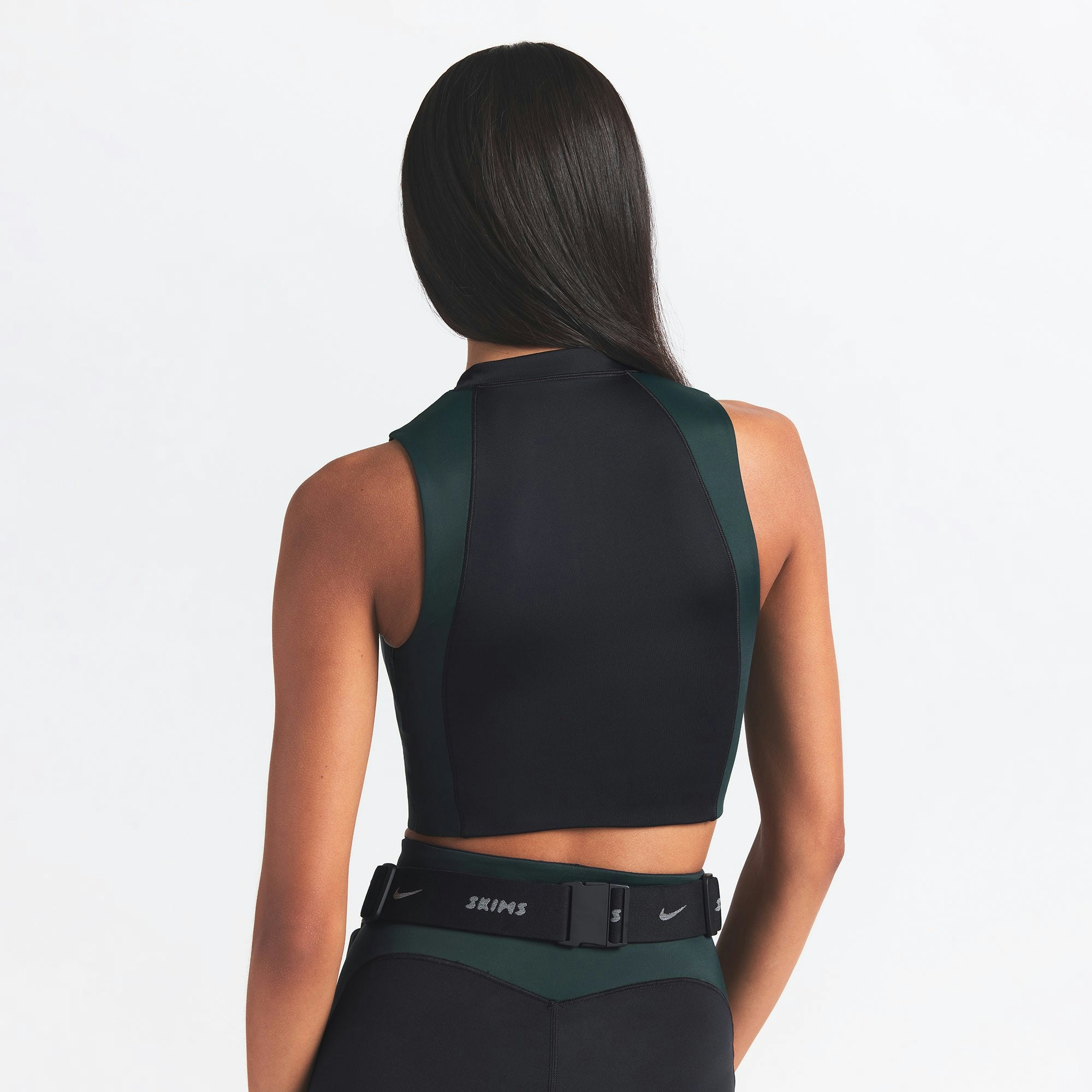 NikeSKIMS SHINE FRONT ZIP BRA | OBSIDIAN AND DARK TEAL ON A MODEL BACK VIEW @ | FOCUS: 0.0, 1.0, 0.9
