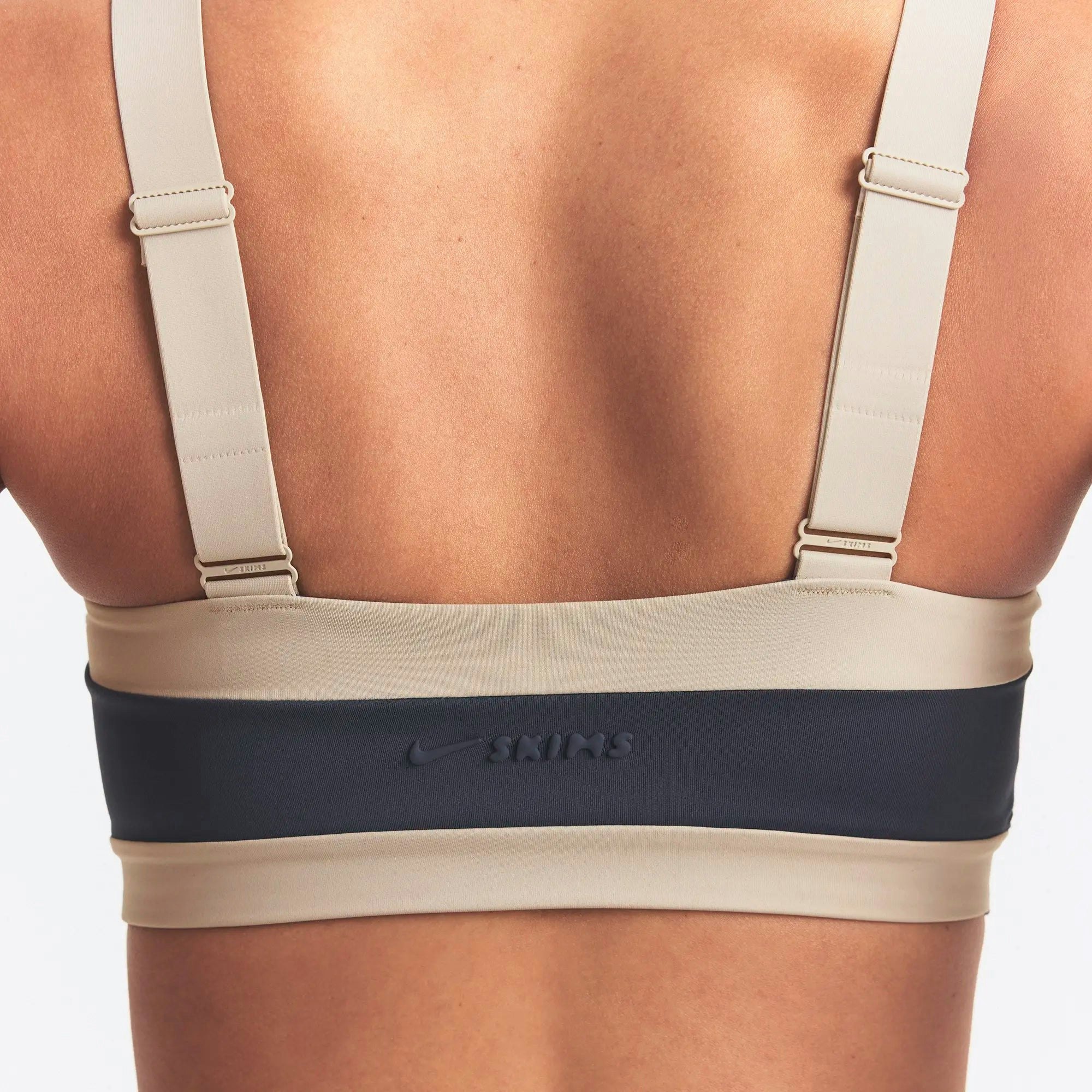 NikeSKIMS MATTE AND SHINE STRAIGHT NECK BRA | DEEP ROYAL/STONE ON A MODEL SIDE VIEW @ | FOCUS: 0.0, 1.0, 0.9