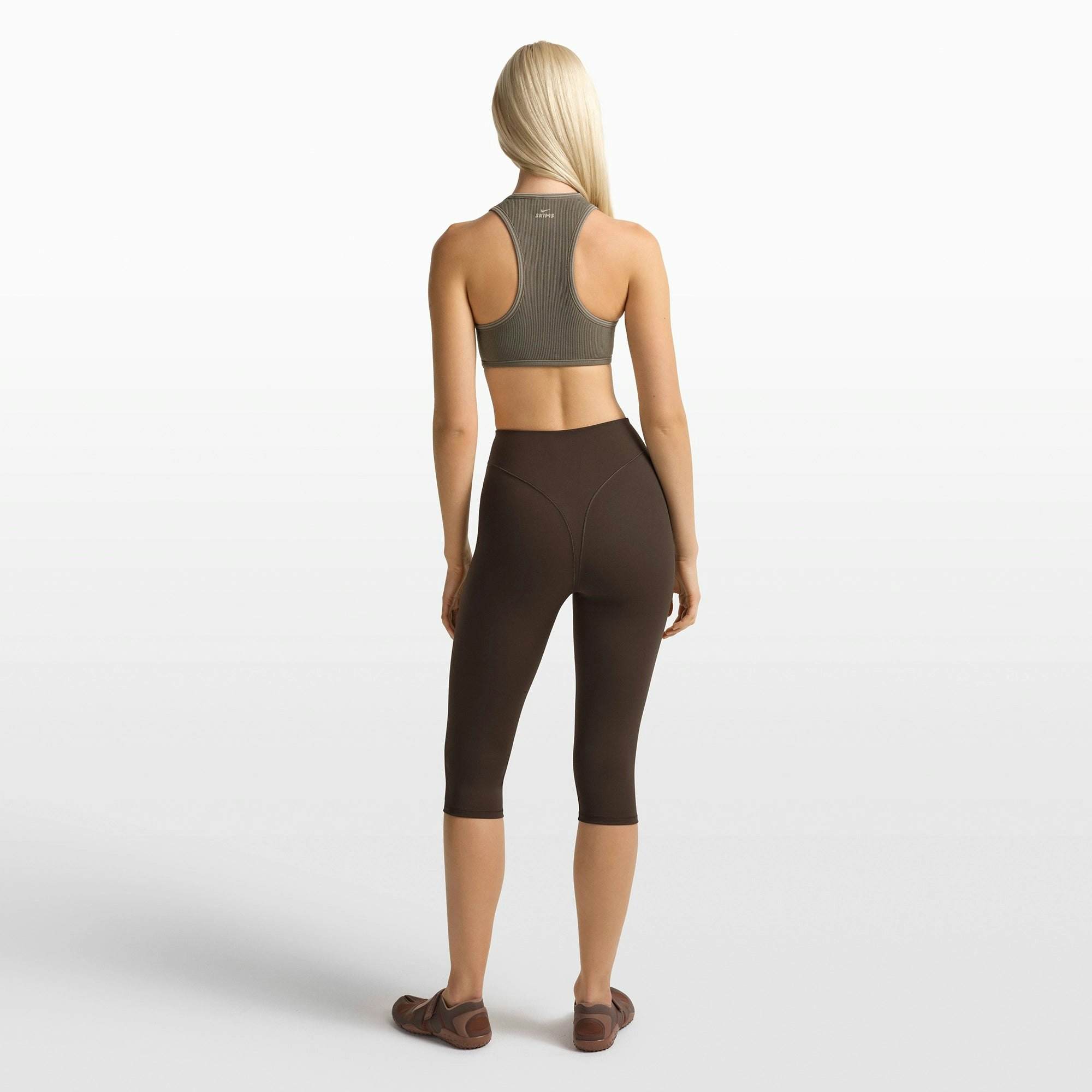 NikeSKIMS RIBBED SEAMLESS RACER FRONT BRA | DUSTY OAKMOSS/DUNE ON A MODEL FRONT VIEW @ | FOCUS: 0.0, 1.0, 0.9