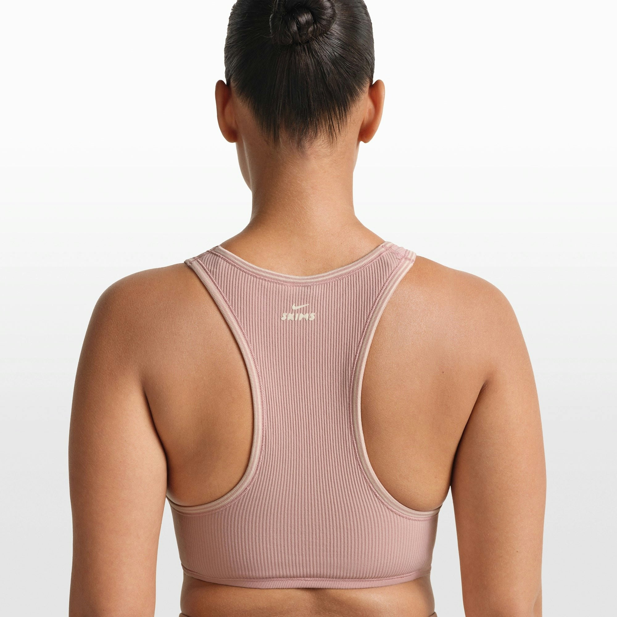NikeSKIMS RIBBED SEAMLESS RACER FRONT BRA | HIMALAYAN ON A MODEL FRONT VIEW @ | FOCUS: 0.0, 1.0, 0.9
